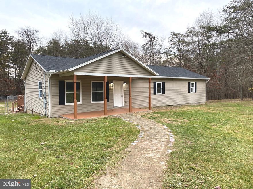 LIKE NEW! This large 4BR/2BA rancher has been extensively remodeled! Tucked away in a  secluded neighborhood and sitting on 2+ acres you'll love the privacy that this home affords you. With a new roof, new flooring & paint throughout, an entirely brand new bathroom, new lights, new outlets, and a brand new kitchen from floor to ceiling, there's nothing left to do except move in! The spacious kitchen offers new appliances, new cabinetry, and new granite countertops, a very large pantry, and is centrally located between the living room and the dining room. There are 4 nice sized bedrooms, 3 of which have very roomy walk-in closets! The master bedroom has an en suite. There is a large unfinished basement with a side entry one-car garage. Plenty of space for rooms, a workshop, or storage. This fantastic 2+ acres boasts chain link fencing in the back yard with a separate large enclosed area and a large dog house. Relax on your front porch, or grill on your back deck overlooking the above ground pool,  both large enough for your outdoor furniture. Schedule your showing today!