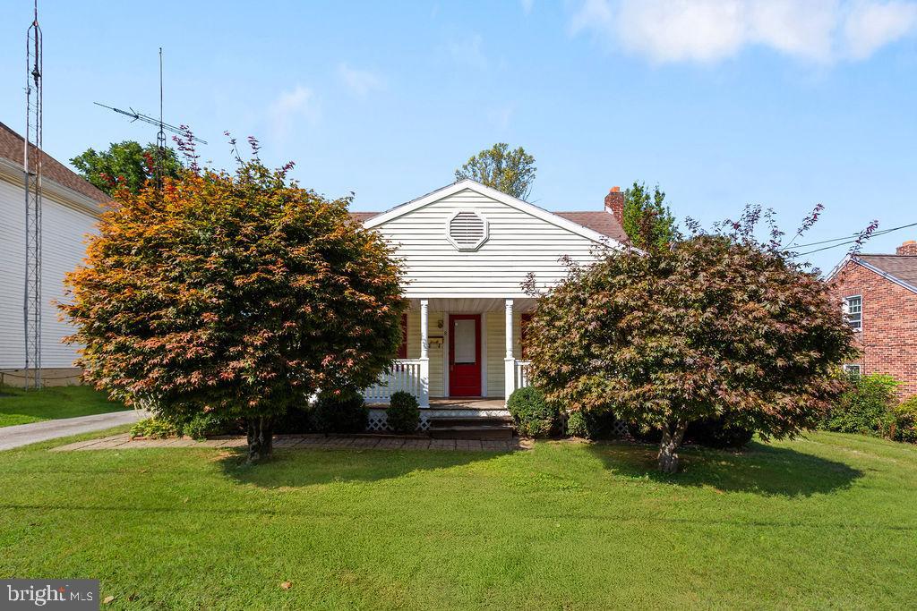 This home is being sold AS Is to settle estate. Home on nice size lot with private back yard which can be accessed from the alley in rear. Brick patio and old shed in rear yard with mature trees. Two car garage is accessed by circular driveway which aids in exiting onto Main St. Large covered concrete porch along front of home. Home needs remodeled and additional finished space could be added with full stairway to second floor. Basement is about 75% concreted. A great fixer upper!