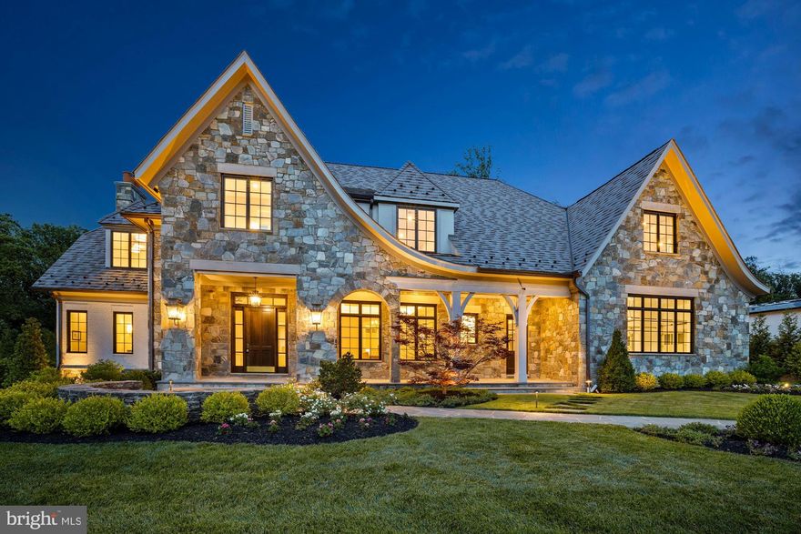 A premier offering in the prestigious enclave of Mackall Farms, this exceptional residence exhibits elevated craftsmanship and uncompromising luxury.   A collaboration of McLean-based Winthrop Custom Builders, Andy Staszak Interiors, and Fine Landscapes by Charles Owen, the home seamlessly blends transitional elements with timeless design to create a gracious, yet refined living environment.   Exterior elements incorporate natural field stone and painted brick, an EcoStar Empire Shake roof, masonry built chimneys, a saltwater pool, and a 4-Car Garage.  An elevator accesses all floors of the home.  The Main Level features both white oak hardwood and limestone floors as well as bespoke millwork and detailed trim work.   Beyond the impressive 2-story Foyer lies the Great Room with gas Fireplace, stone mantel, quartersawn white oak custom built-ins, and two sets of French doors to the rear loggia.  The formal Living Room with wet bar, elegant Dining Room, and a private white oak paneled Library with rear exterior access provide ideal work and entertaining spaces.  A magnificent Kitchen with custom built inset cabinetry, soapstone countertops, Wolf/Sub-Zero appliances, and Morning Room with cathedral beamed ceiling and 180-degree views overlook the tranquil backyard.   Conveniently, a generously sized Mudroom with direct garage access, 1 of 2 Laundry Rooms, a Half Bath, oversized storage spaces, and separate entrance completes the everyday living spaces.  The Upper Level continues with white oak floors throughout.  The expansive Primary Owner's retreat features a gas Fireplace, French doors to a private terrace, two custom designed Walk-In Closets, and a light-filled luxurious Bathroom finished with natural stone, a free standing soaking tub, two water closets, and two separate glass-enclosed showers.  The secondary Bedroom Suite includes a large sitting room, Bathroom with separate water closet, and walk-in closet.  The second Laundry Room, a rear staircase, and 2 additional Bedrooms, both ensuite and with walk-in closets, complete the Upper Level.  The walk-out Lower Level is equally impressive with a fully outfitted custom wet bar, 1085-bottle wine cellar, Recreation Room with rustic beamed ceiling and gas Fireplace, state-of-the-art Home Theater, Fitness Room, a 5th Bedroom suite with Full Bath, and conditioned storage areas.  The thoughtfully designed backyard living experience features a saltwater pool with spa and water feature, outdoor grill Kitchen, gas firepit, covered flagstone loggia with Fireplace, oversized patio, mature landscaping, and natural privacy screening, all perfect for relaxing, entertaining, alfresco dining, or gardening.  The home is also outfitted with a Lutron lighting system, alarm system with cameras, commercial grade internet, and an irrigation system.  Ideally located just 5 minutes to the GW Parkway or Beltway, 6 minutes to the Chain Bridge, 10 minutes to Tysons, 12 minutes to Arlington, and equidistant from Reagan and Dulles airports.  Experience the splendor and ease of a turnkey offering available now.