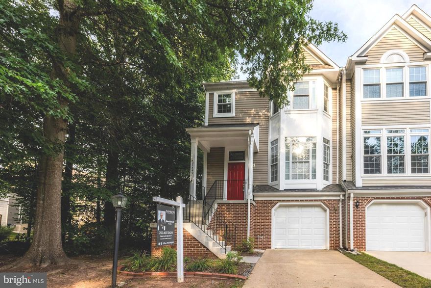 Absolutely beautiful and meticulously fully upgraded end-unit townhouse in sought after Lowes Island association. With over 2000 sqft living space, this home has been upgraded from top to bottom, with a state-of-the-art kitchen with quartz countertops, contemporary cabinet models, and SS appliances. Hard wood floors throughout the house including all the stairs.  Beautifully upgraded main and second bathroom at the top level. Recessed lights throughout main level and basement. HVAC replaced. Spacious deck off of kitchen and family room with spiral stairs to the open downstairs patio. Built-in closets in the garage, basement, and master bedroom, for ample additional storage. One-car garage, with drive way, and plenty of unassigned additional parking. Come visit, fall in love, and make this home yours!