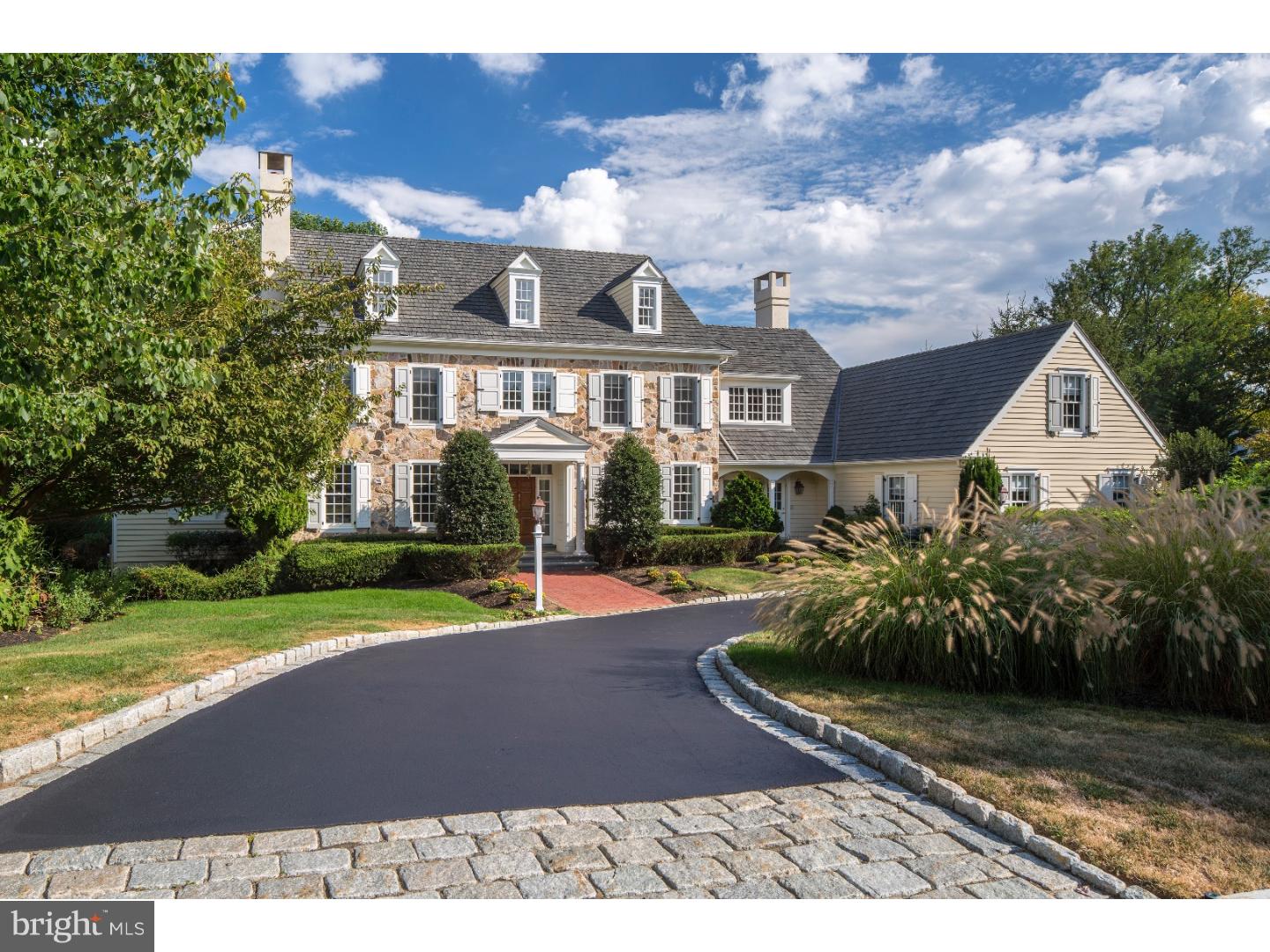 Stately STONE MANOR HOME w/ INCREDIBLE CURB APPEAL Designed by Visich Architects & Meticulously Crafted by POHLIG Builders. Perfectly nestled on a Premier Lot in the prestigious community of HARRITON FARMS (once part of a 600 acre farm), the development encompasses 54.9 acres - 1419 LANES END is beautifully sited on a professionally landscaped 3/4 /- acre taking full advantage of VIEWS of NATURE, OPEN SPACE, PRESERVATION & COMPLETE PRIVACY. The "Creighton Model" features an Ultra-Rare 1st FLOOR MASTER BEDROOM SUITE & flexible/diverse floor-plan perfect for Family Living. Ornate details inside & out include handsome Stone Facade, AMAZING SUN-DRENCHED INTERIOR w/Walls of Windows, Soaring Ceilings, extensive use of Crown Moldings & Wainscot, Deep-silled Arched windows & doorways, re-claimed beams, Gleaming site finished HW Floors, Designer fixtures & Imported Marbles & Granite. This (6) Bedroom (4) Full & 2 1/2 bath home is accessed by a Belgium Block lined circular drive that leads to a grand 2-story Entrance Hall w/Gorgeous Carved Staircase, Formal LR w/ Marble FP, Large Formal DR w/adjoining Butlers Pantry, Chef's Dream Kitchen w/Vintage White Maple Cabinetry, Granite Counters, Large Entertaining Island & Professional Appliances including Dual Thermador convection ovens, Miele dishwasher, Thermador(5)burner range & SUBZERO refrigerator OPENS TO the Breakfast Room & Sun-drenched FAMILY ROOM w/Vaulted Ceiling Hand-Cut Floor to Ceiling Stone FP w/French Doors to Incredible Flagstone Terrace overlooking SERENE YARD (Perfect for Outdoor Entertaining). Luxurious Master Suite w/Tray Ceiling, His & Her Walk-in Closets, Beautiful Spa-Like Marble Bath w/Deep soaking tub, stall shower, double sinks & water closet ATTACHED Cherry Paneled Library w/Walls of Windows & Built-in Bookshelves. The 2nd level offers (3)Additional Bedrooms & (2)Full baths. Newly Renovated Day-Lit Lower Level features Au-Pair & In-Law Suites, Media, Game Room, Office, Massage Room, Gym & Full Bath. Additional Features include: Whole House GENERATOR, Oversized(3)Car Garage, Freshly Painted Interior, New Carpeting, Refinished HW Floors, AMAZING YARD w/APPROVED PLANS FOR A POOL. Award winning Lower Merion Schools, (2) MILES to the Center of Bryn Mawr(train, shopping, restaurants, Starbucks). This exquisite REFRESHED home feels "NEW AGAIN" and is perfect for Comfortable Family living & befitting of Grand-Scale entertaining. DO NOT WAIT!!!