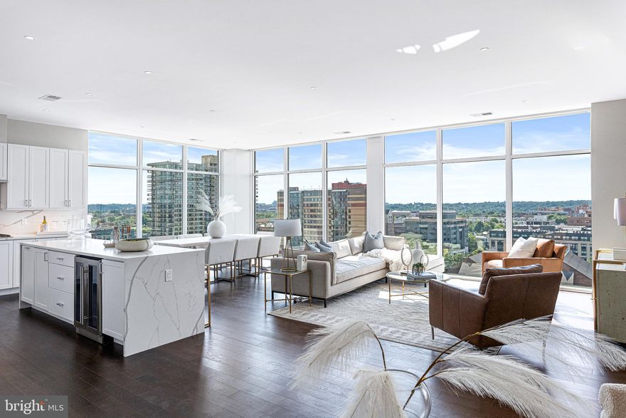 RARE OPPORTUNITY TO PURCHASE A PENTHOUSE AT VENUE, Old Town's newest luxury condominium building!  This 3 BED + DEN PH offers 2200 sq ft of living space and upgrades galore!  It features soaring 10 ft ceiling heights and walls of windows offering an abundance of natural light. Every room showcases expansive views of the city skyline, DC, and National Harbor!  Built by renowned  local developer, Carr Companies, the finishes in this Penthouse are extraordinary.  Chef's kitchen features Bosch & Thermador appliances, Calcutta Quartz countertops, two built-in wine refrigerators and custom cabinetry. The spacious Primary Bedroom suite features a massive walk-in closet and an en-suite upgraded Marble Bathroom with double vanity and walk-in shower (with a 5 point shower head + detachable nozzle).  VENUE offers a turn-key elevated lifestyle. Enter through the hotel-style Porte-Cochere into our Grand Lobby, where you will be met by our Full Service Concierge and on-site building manager to assist with your every need.  The building features a sprawling Rooftop Terrace offering expansive panoramic views of the DC Monuments, Potomac River and Old Town skyline as well as an outdoor grilling station and fire pit seating area. The elegant indoor Owner's Sky-Lounge is equipped with flat screen TV's, fireplace and a cocktail bar, perfect for entertaining!  Relieve your stress in the State-of-the-art Fitness center complete with a  Barre studio.  VENUE is the ideal location in Old Town's most desirable neighborhood, right in the center of entertainment, restaurants and shopping, with direct access to the Mount Vernon Trail. Come see what all the fuss is about!  Immediate Occupancy available.