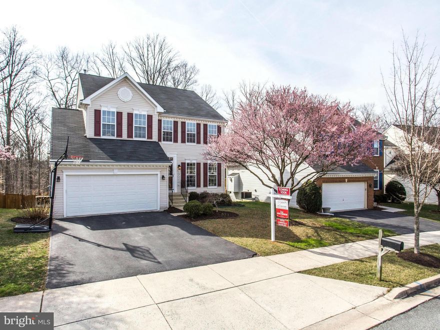 Offers to be considered Sunday morning - no showings  after Saturday. Affordable Luxury on Premium Lot. This 4 BR 3 1/2Ba. w/ over 3500 fin sq ft, gleaming hardwds, updated kitch w/granite, isl. & brkfst/sun rm, spacious BRs, new lighting, fresh paint, large basmnt rec rm & office space & newly renov. bath, great deck & patio w/ fenced backyard backing to trees. Solar Panels installed w/contract.