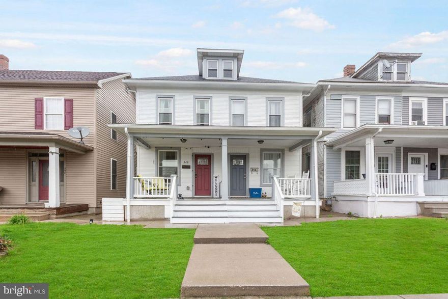 This beautiful semi-detached home is updated and move in ready.  The cute front porch is just waiting for your chairs and warmer weather.  Step inside and notice the beautiful LTV flooring throughout the 1st floor.  This home has neutral paint and tons of windows letting in lots of natural light.  The pretty living room leads to the dining area that can hold a nice sized table.  The kitchen has gas cooking, butcher block counters and an eat at island.  The half bath/laundry combo is super convenient.  Let's take the partially open staircase upstairs to the 3 bedrooms, and a beautiful full bath with double vanity, and there is also a walk up attic for storage.   Out back there is a fenced in yard and a large deck, great for entertaining.  Newer windows and newer roof give you peace of mind.  2 paved parking spots off of the alley in the back are a major plus.  Hurry, this home won't last long!