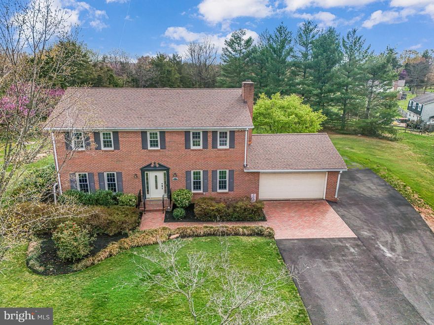 This beautifully updated Colonial offers over 4,000 interior sq. ft. with a **flat, 1-acre lot** on a cul-de-sac. With **five bedrooms, 3.5 baths, and a 2-car garage**, this home has been thoughtfully enhanced with **high-end 2025 renovations**, that include a luxurious owner’s suite bath, a remodeled hall bath, a lovely powder room, and newly refinished oak hardwood floors. Plus, the **gorgeous 2025 finished basement** adds incredible opportunities for additional living space or a full guest suite with a bonus room for a bed and full bathroom!

The main level showcases gleaming refinished hardwoods, a formal living room, a separate dining room, and a cozy family room with an exposed brick wall and fireplace. The updated powder room (2025) adds a modern touch, while the **spacious 20’ x 15’ sunroom**—complete with dual ceiling fans—offers the perfect spot for entertaining or everyday relaxation. The eat-in kitchen provides generous counter and cabinet space, recessed lighting, and seamless flow into both the sunroom and dining room.  

Upstairs, **all five bedrooms feature newly refinished hardwood floors**, including the impressive owner’s suite with a **brand-new (2025) spa-like ensuite bath**. This beautifully designed retreat boasts a freestanding soaking tub, dual sinks with a white poplar vanity (country oak finish) and quartz countertops, a porcelain tile floor, and a separate shower with a stone mosaic floor and ceramic wall tile. The **remodeled hall bath (2025)** features a custom tile surround, dual sinks with quartz countertops, a white oak vanity, and porcelain tile flooring—blending elegance with a fresh, modern aesthetic.  

The **walk-up lower level, completely remodeled in 2025**, expands the home’s possibilities with a generous recreation room, a full bathroom, and two versatile bonus rooms—one currently staged as a bedroom (not a legal BR) and the other perfect for a home office or playroom. An unfinished utility/storage area offers excellent potential for a home gym or workshop.  

Located just minutes from shopping, dining, grocery stores, and wineries, this exceptional home is part of a small HOA with a low $500 annual fee for snow removal and road maintenance. **Don’t miss this rare opportunity to own a beautifully updated home on a private 1-acre lot!**