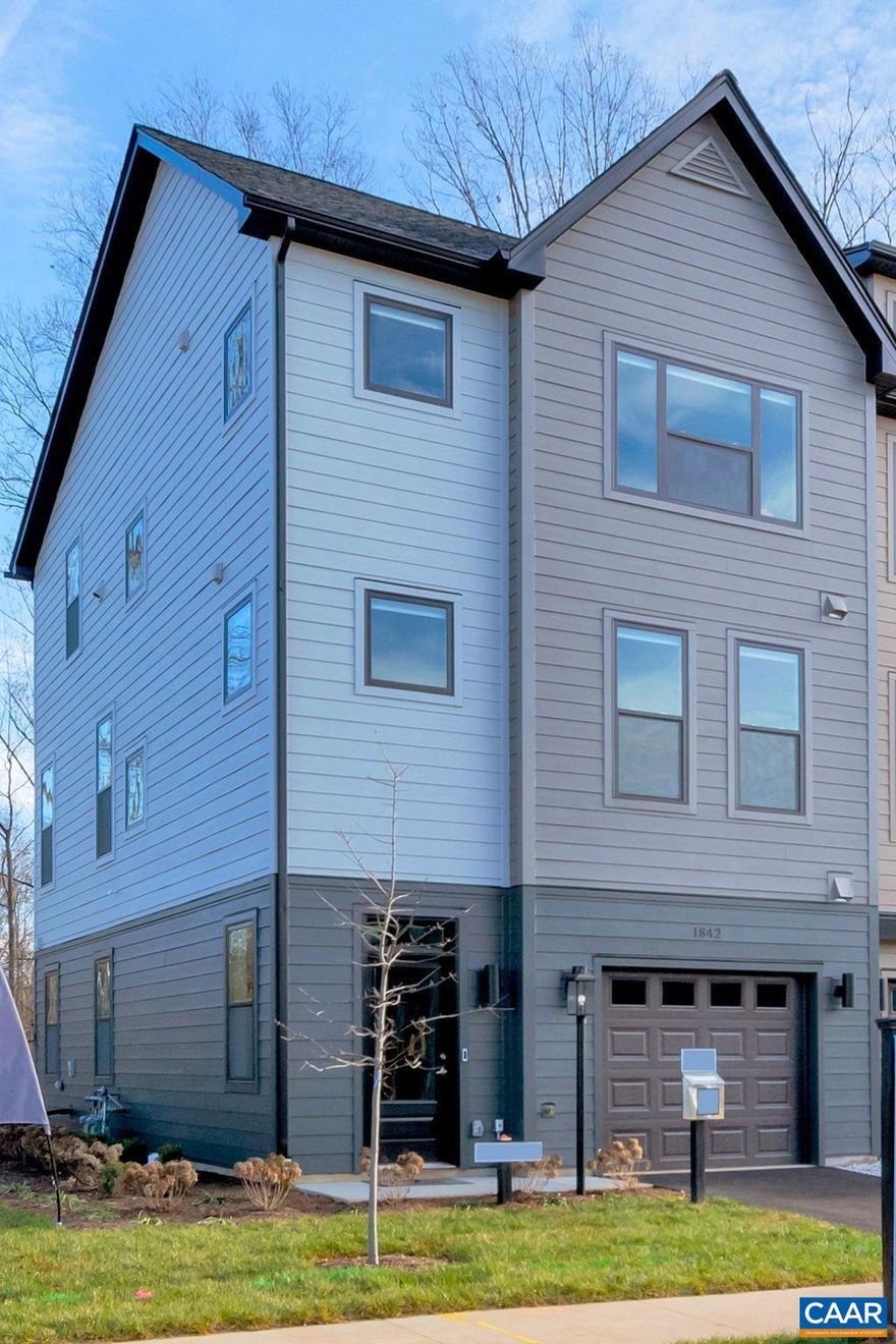 LAST END UNIT.  Fall delivery. This Bainbridge end unit townhome features 3 BR, 3.5 bath, flex room/office, & attached garage. A thoughtfully designed open floorplan includes spacious great room, dining & kitchen w/ oversized 9' island, granite counters, and soft close maple cabinetry. An oversized TREX deck backs up to mature trees for relaxing evenings, morning coffee, and outdoor entertaining. Belvedere is an established community centrally located to all things C'ville, just 2 miles to the Downtown Mall & RT 29 shopping, 5 miles to UVA, and surrounded by nature & the Rivanna Trail. LAWN CARE & TING FIBER internet included in HOA. All homes are 3rd party tested for energy efficiency & come w/ PEARL GOLD certification. Similar Photos.,Granite Counter,Maple Cabinets