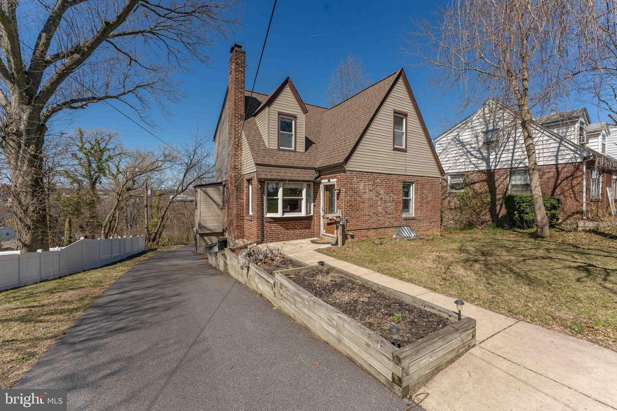 Welcome to 1522 Steel Road, a 3-bedroom, 2-bath Cape Cod home located in Havertown. As you approach the home, a long driveway leads to a welcoming walkway and front entrance. Inside, the living room features hardwood floors, a bow window, and a brick surround wood-burning fireplace, creating a warm and inviting space. This level includes a convenient bedroom with hardwood floors and a ceiling fan with light—perfect for guests or in-law living. The dining room, which also offers hardwood flooring and a chandelier, opens to a home office space with hardwood floors, built-in cabinetry, and a sliding door leading to the deck. The kitchen offers luxury vinyl plank flooring, quartz countertops, stainless steel appliances, and a pantry area. A full bathroom completes this level with tile flooring and a step-in shower. Upstairs, the second level features a bedroom with hardwood floors, along with a bonus room ideal for a playroom, hobby space, or additional living area. The primary bedroom includes hardwood floors and a ceiling fan with light. A full bathroom offers tile flooring and a tub/shower combination. A sitting room with hardwood floors and a ceiling fan provides additional flexible space to suit your needs. Conveniently located near local shopping, restaurants, Llanerch Country Club, and Hilltop Park, this home also offers easy access to Route 476 for commuting. Don’t miss the opportunity to make 1522 Steel Road your new home.