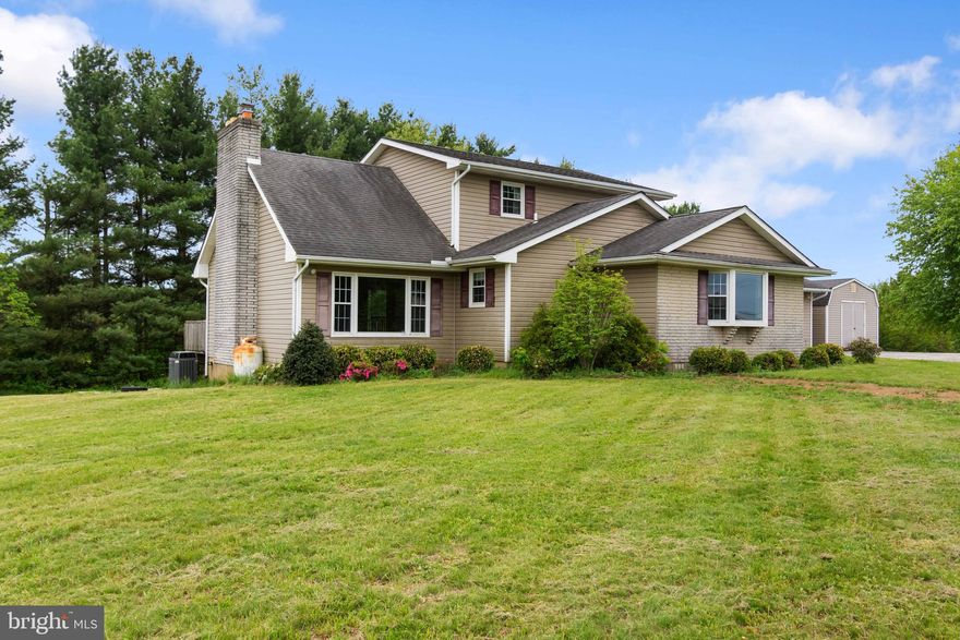 Tucked into the rolling countryside of Westminster, this home at 1525 Bachmans Valley Rd offers the kind of setting people move for but rarely find. Surrounded by natural beauty and just minutes from outdoor favorites like Bear Branch Nature Center and Hashawha Environmental Center, the location strikes that perfect balance between peaceful and connected.
Inside, the home opens up with a dramatic cathedral ceiling that creates an airy, expansive feel the moment you walk in. Natural light pours through the space, highlighting the warmth of the fireplace that anchors the main living area and makes it feel instantly inviting.
Step outside onto the deck and you’ll understand what makes this property special. The view stretches out over the surrounding landscape, offering a private, elevated perspective that’s ideal for morning coffee, quiet evenings, or hosting friends.
If you’ve been waiting for a home that combines scenic surroundings, standout architectural details, and everyday comfort, this one delivers in all the right ways.