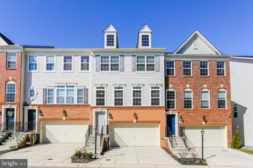 Beautiful three level townhome built in 2017 located in the Boyers Ridge Subdivision of Severn! Enter into the foyer with steps leading you either up into the main level or down into the lower level. The carpeted lower level has a  spacious family room, half bathroom, small outdoor patio, and garage access. Up on the main level you'll walk onto the hard wood floors of the living room and dining area w/ a half bathroom, kitchen w/ granite countertops and steel appliances. Next to the kitchen, there's a separate small living area w/ a gas fireplace and outdoor balcony. The upper level includes 3 total bedrooms and 2 full bathrooms. The Owners Suite is equipped w/ a master bathroom and balcony. The master bathroom has a double sink, walk in shower, and jacuzzi. The separate full bathroom also includes a double sink and bath/tub.  Two car garage as well as two parking spaces in front of the house. Community pool included in $97/month HOA fee.  Less than 10 minutes from Arundel Mills Mall, grocery store and other nearby shopping amenities. About 30 minutes from Downtown Baltimore. Book a showing today!