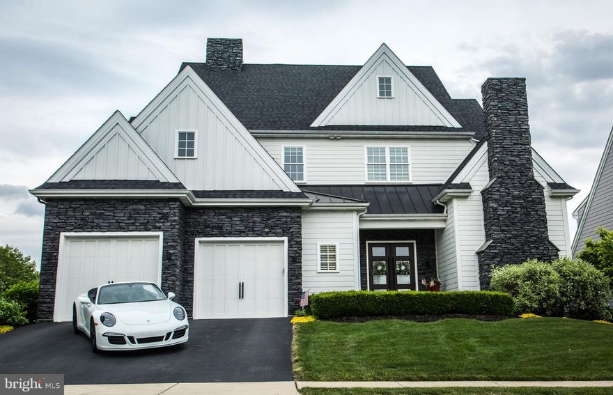 Beautiful custom home in the desirable Stonehenge Reserve is central and convenient to schools, highways, shopping, healthcare, Lancaster City and Lititz Borough. Stately entry opens to twelve foot ceilings throughout the first floor, large windows that provide tons of natural light, and gorgeous wide plank hardwood floors with custom stain. Through the foyer you pass the first floor theater with projector with sliding barn door entry to enter the open concept living, dining, bar, and kitchen that makes for a great entertaining space. The huge gourmet kitchen features plenty of granite counter workspace, large island with waterfall edge concrete counters, stainless steel Thermador appliances, and a large walk-in pantry. Your eyes will be drawn to the 2-sided gas fireplace with stone surround or out the back windows to your spacious covered patio with built-in grill and pool deck that overlooks the community pond. The heated in-ground saltwater pool is the perfect place to host your summer get-togethers. Second floor of the home features 4 spacious bedrooms including two suites with private bathrooms. Third and fourth bedrooms share a third bathroom and one of the rooms offers a vaulted ceiling with loft space. The main primary suite boasts great views of the pond, tray ceiling and crown moldings, and a luxury bathroom with heated tile floors, vessel soaking tub, large tile shower, separate vanities, and huge custom walk-in closet.  The spacious finished lower level provides lots of sunlight throughout and makes for a great family room area and offers additional home gym or office space. Oversized, extra deep garage features parking space for 3 cars and large loft storage space as well.