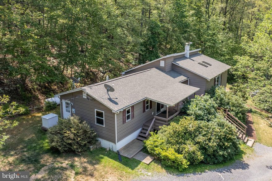 PRICE ADJUSTMENT.    Peace and quiet awaits you far from the fast pace of the hustle and bustle of everyday life.  There is so much to offer here, including an abundance of wildlife,  flowering shrubs and trees such as azaleas, rhododendrons, mountain laurel, and fruit.   Five unrestricted acres, (no HOA),  with a personal target/shooting range, roads and paths to explore on your four wheelers, and wet weather streams where the water flows directly out of the mountain.  This home is close to the Tuscarora Trail and five minutes from The Cove Campground , which has camping, boating, swimming, fishing, and off road events.  These are just a few of the reasons why the sellers,  the one and only family, have lived here for over 40 years.   170 Frye Path Road could be your full time residence, second home in the country, or an Air B and B.    The sellers have taken it upon themselves to prepare the home to be move in ready for any buyer.      (See the list of updates/improvements under documents).  The interior of the home is spotless from top to bottom.   Come and check out this wonderful home and property  today.  (Please note security cameras are on premises)