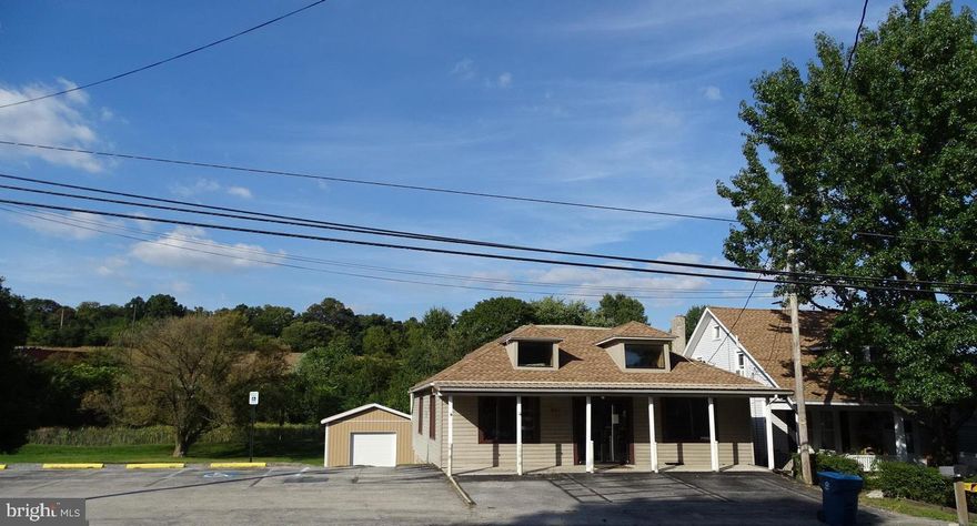 GREAT INVESTMENT PROPERTY! MIXED COMMERCIAL Presently used as bakery/ restaurant  & catering  private meeting/party space available. GREAT LOCATION!! Up and coming area .... and on busy CORNER LOT with detached garage... endless possibilities here!!