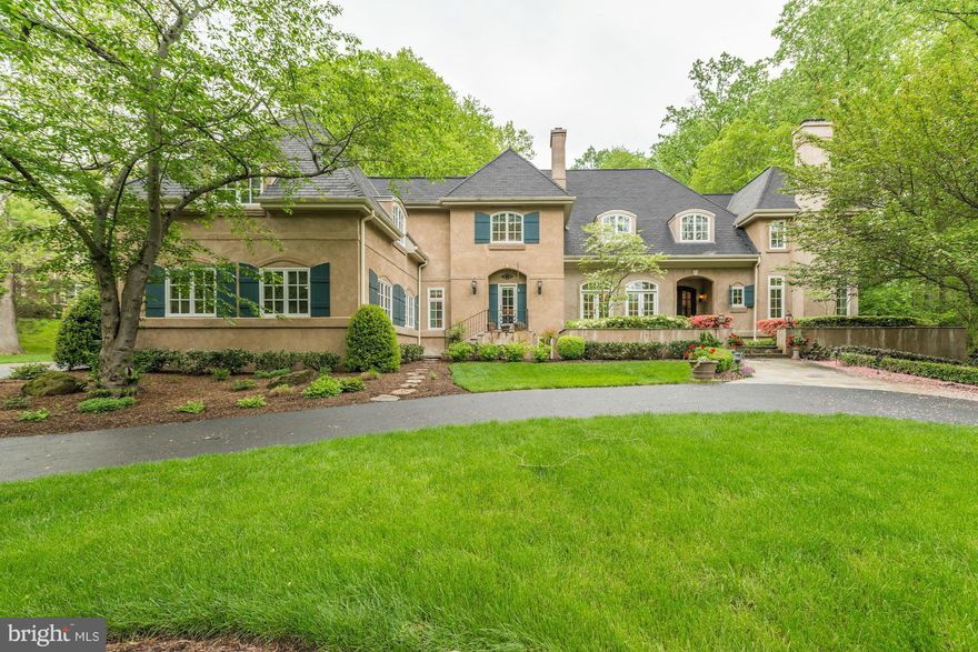 Stunning French Country Colonial on beautiful level lot in sought after Langley Forest. 10' ceilings on main level, arched openings, beautiful windows & French Doors. Gorgeous kit w/many custom features opens to sun room & family room..Elegant private office. Six bedrooms on upper level. Wonderful master suite with coffee bar & enormous closet. Large private yard, oversized patiopergola & hot tub.