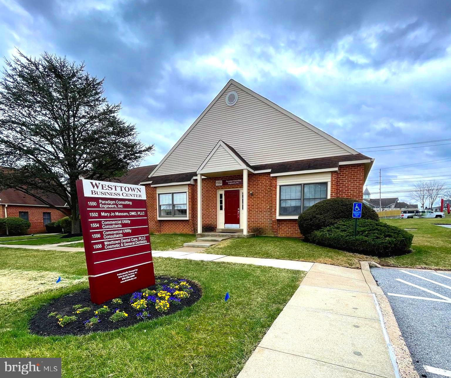 Westtown Business Center - Prime Location for a Medical/Dental/Professional Office Suite! Currently tenant occupied and month to month...Immediate occupancy available in this sought after business center. Perfect professional space with 2,000 square feet of office space (1,000 on each level). Main level offers open reception/lounge area, full kitchen with white cabinets, refrigerator and microwave, powder room, large utility or storage closet and 3 offices/conference room area. Lower level offers 2 large offices, 2nd reception/lounge area and lots of storage. Newer wooden window treatments for privacy and security system. Newer water heater. Rent includes monthly association fee, parking, exterior maintenance and trash removal. Tenant pays for telephone, water, electric & gas. This is an end location and provides ideal business exposure for your office with plenty of free parking!