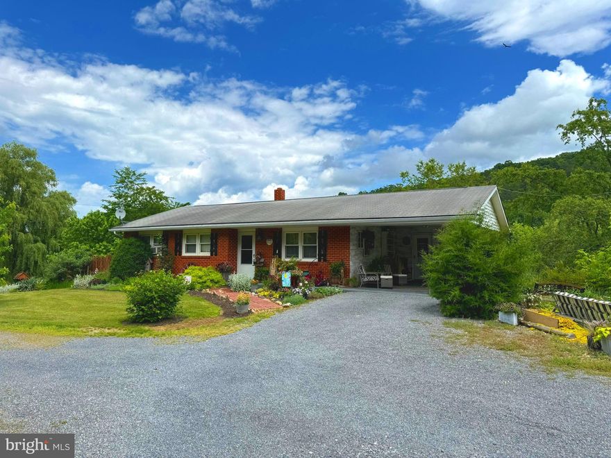 Beautiful piece of almost heaven WV! This home is beautiful inside and out! The landscaping is just the beginning of what this home has to offer. From the flower beds, pool and stream to the original hardwood floors and beautifully updated interior, this home has it all! 2.5 acs of rolling and flat land would be perfect for your kids to sled and plenty of room to have your animals too. The stream is the perfect place to splash and play to cool off in the summer.