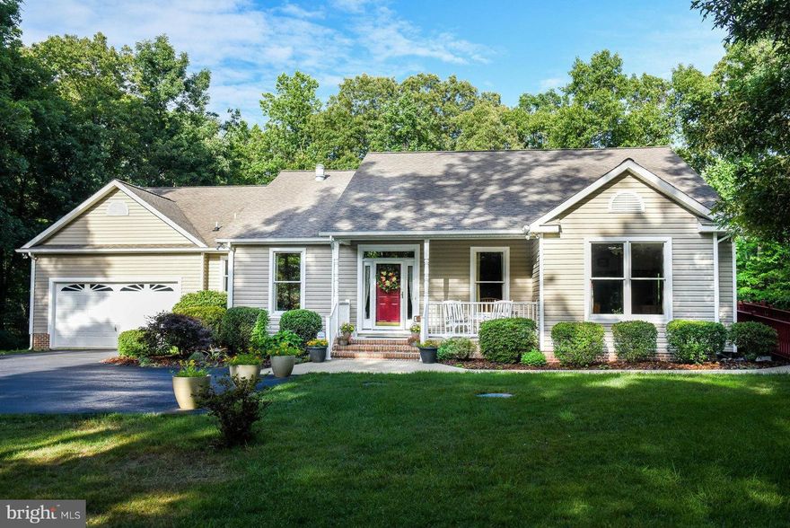 Must come in to enjoy the spaciousness of this home! Handicap accessible main level has 2 full SS & stone kitchens, 2BR, 2.5 BA. LL w/3BR, 1.5 BA. Wide oak doors & cabinetry. Oak floors in many areas of main floor. Sunroom, library, FR, 2 laundries, storage galore, 2 decks & LL patio. 2 car garage. Back-up generator. Dual heat pumps w/ back-up gas.  Quiet 2 acre treed lot. WFDES, LMS and LHS.