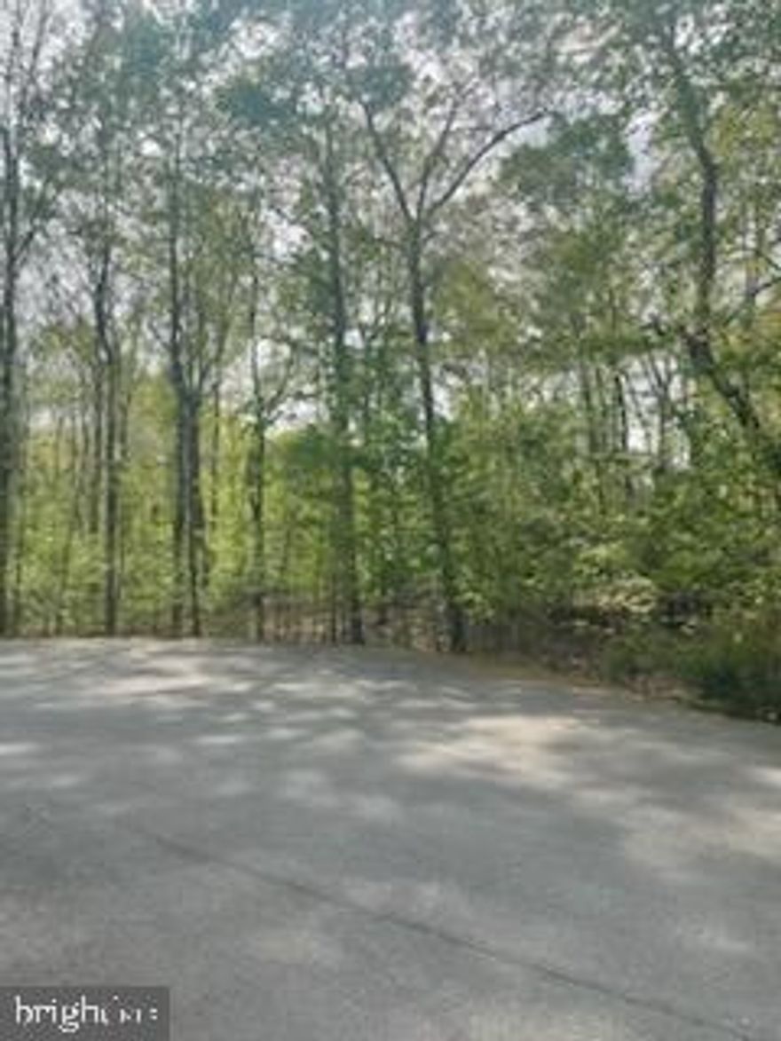 1-Acre Lake Access Lot – Public Side of Lake Anna----Opportunity awaits with this quiet wooded lot located on a PRIVATE CUL-DE-SAC in the Rose Valley subdivision. Enjoy a gated common area with a private BOAT LAUNCH, daily boat docking, pavilion and picnic area, perfect for weekends on the water.----CONVENIENTLY LOCATED just minutes from waterfront restaurants, a gas/convenience store, and a short drive to Lake Anna State Park. The property is zoned RR (Residential Resort) in Spotsylvania County, allowing for low-density single-family homes and limited complementary commercial uses such as small shops.----SHORT-TERM RENTAL are permitted, and the HOA is minimal.----Whether you’re planning a PRIMARY RESIDENCE, vacation retreat, or INVESTMENT rental, this lot offers the flexibility and location that you want. The seller is hoping to be lucky enough to receive multiple offers and will be holding a decision until Monday 4/28. Please get your offer in to me by Sunday evening 4/27.