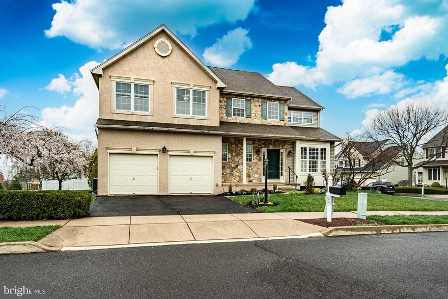 Welcome to Olde Village, Skippack. Just steps from beautiful Skippack Village, 2059 Serendipity Way is the home you have been waiting for. Situated on a picturesque corner lot in one of Skippack's most desirable neighborhoods, you will be captivated from the moment you arrive. This colonial-style home is oozing with character and charm, starting with the undeniable curb-appeal. Take in the beautifully maintained garden beds, stone and vinyl facade, and blooming shrubbery as you make your way to the covered porch entry. 
As you enter, take notice of the impeccably maintained and professionally refinished hard wood flooring, running throughout the main level. Continue through the formal living room, into the large dining area with natural light pouring in from every direction. Make your way to the large eat-in kitchen which features natural stone countertops, a large island with under-mount copper sink, stainless steel appliances including a slide-in range with gas cook top, and beautiful premium cabinetry with antiqued finish.
Adjacent to the kitchen, you will find the open and airy family room with high ceilings, overlooked by the upstairs hallway, and featuring a two-sided gas fireplace. Continue into the den/sunroom and sit by the opposite side of the two-sided fireplace and enjoy the sunshine, or step outside to the large multi-level pressure-treated deck with privacy screening and retractable awning!
Finishing the main level are the tastefully appointed powder room for guests to enjoy, and the large laundry room which opens into the attached two-car garage.
Ascend the steps, with brand new plush carpeting, to the upper level. Proceed through the double doors into your expansive owner's suite, a highlight of the home. Bathed in natural light from a large bank of windows, and with high angled ceilings, this is much more than a bedroom. Spend your time in the comfortable sitting area overlooking tree-lined Serendipity Way, dressing for the day in the large walk-in closet, or enjoy the spa-like experience of the owner's bath area with tiled floor, cathedral ceiling, and jetted soaking tub. 
The second and third bedrooms are larger than you will expect, each with adequate storage, and finishing up the upper level is a large hall bath with double sink and shower/tub combo. Don't forget to check out the large full basement, currently unfinished, with plenty of dry storage and access to the well-maintained utilities. 
The seller is so confident in this beautiful home, which they have lovingly maintained since it was built, that they are offering a One Year Home Warranty through America's Preferred Home Warranty to give you added piece of mind as you get acquainted with your beautiful new home!
Check out the 3D tour, the aerial  video, and come see us in person at one of our three open houses, as this home must be seen to fully appreciate!