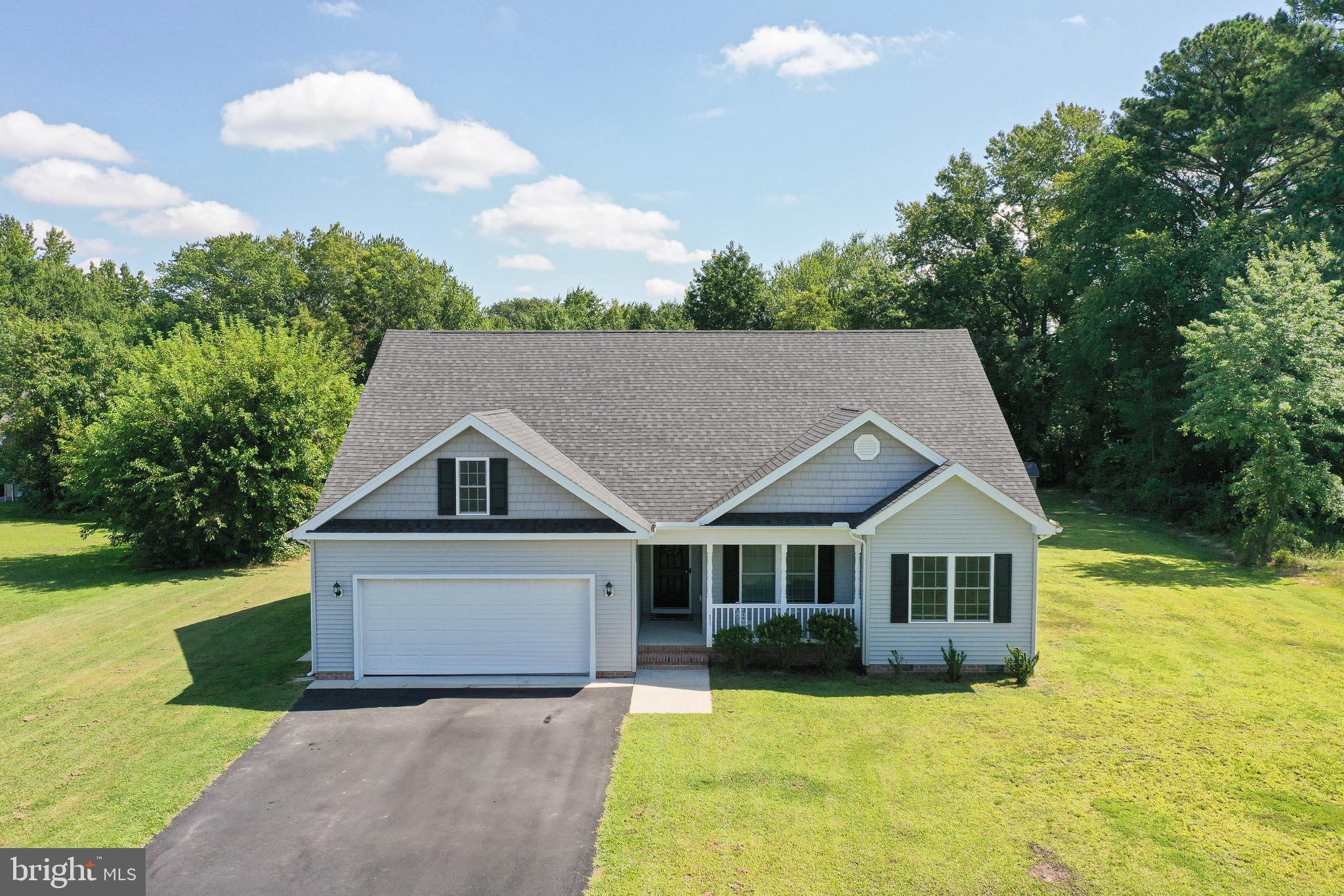 Better than new 3BR/2BA contemporary rancher + walk-up floored attic. Built in 2019 by Osprey Builders, and freshly updated with new paint, new kitchen backsplash, new fixtures, new landscaping, etc. Conveniently located off Cedar Lane, on a residential side street of lovely homes - just minutes to the Bypass, minutes to shopping, dining, and events in Downtown Salisbury or the University, or North Salisbury's retail hub, about 32mi to Ocean City. Incredible floorplan lives large with upgraded finishes throughout. Large living room w/vaulted ceiling, opens into the dining room and kitchen - granite counters, breakfast bar / island, recessed lighting, stainless steel appliances, new backsplash. Primary bedroom w/vaulted ceilings, walk-in closet, full, en-suite bath - double-sink vanity, step-in shower. 2 additional bedrooms and 2nd full bath. Laundry room leads out to the attached 2-car garage and paved driveway. Sizes, taxes approximate