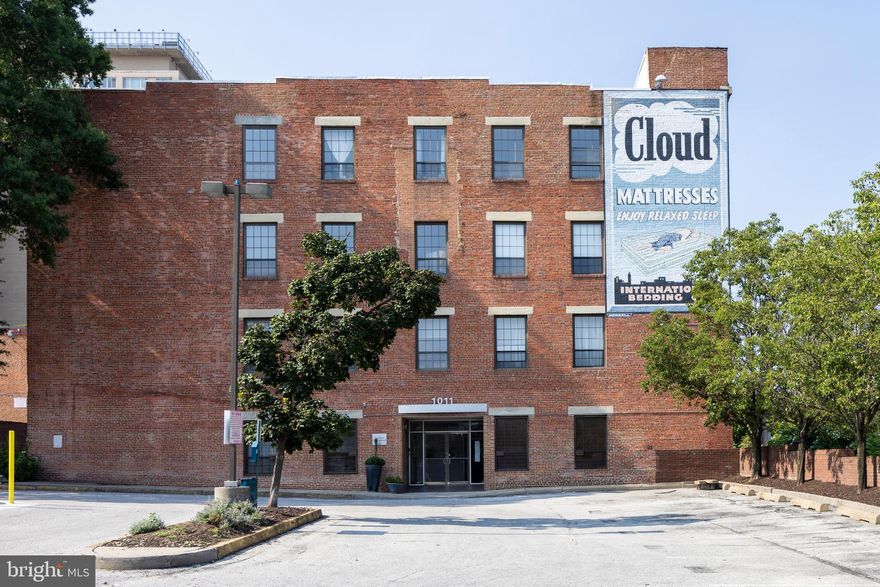 Additional staging is underway and professional photos coming soon! 
Perfect Midtown Location. Feels tucked away from all the hustle and bustle but EVERYTHING is at your fingertips.  Former factory reimagined as a totally unique open air atrium style building. 
Top floor location. 10 foot ceilings! Awesome light. Massive windows with fun city view. Love seeing the Belvedere Hotel!
No need to drive around the block a few times hunting for that elusive parking space. The unit comes with a parking space! Score!
 Nice kitchen with granite counters.  
Come enjoy all that this vibrant area is famous for.
Photos coming soon.