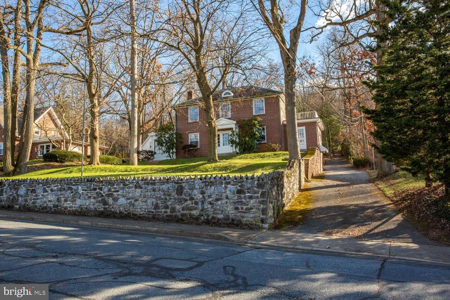 This elegant brick Colonial home sits in a peaceful wooded setting. The front porch or the second-floor balcony give a beautiful view over downtown Ephrata. The partially wooded back yard offers plenty of privacy and the woodland to the rear invites wildlife to your yard. The extensive mature landscaping includes giant oak trees, rare weeping cypress, multiple mature Japanese maples, tulips, ivy, hosta, hydrangeas and pachysandra. The detached garages give you parking for 5 vehicles as well as storage in the attic space. You will have plenty of room for hobbies or a side business, or anything you need a nice workshop for. The lower garage is 19X19 and the upper garage is 23X35. The first floor of the home has beautiful original hardwood as well as tile flooring. The kitchen is updated with quartz counters and plenty of cabinet space. There is a large dining room as well as a family room with a brick fireplace. Both sides of the home have a sunporch that would work perfectly for separate offices, especially since both have outside entrances.  The second floor has 3 bedrooms, a full bath and access to the balcony over the one sunporch. There is a full unfinished attic for plenty of storage space. The basement includes a finished room for flex space, a shower, laundry and a number of storage or hobby rooms. The basement also has an outside entrance. The original charm of this home and the peaceful wooded setting give you that England bed and breakfast feel. Schedule a time to take a tour!