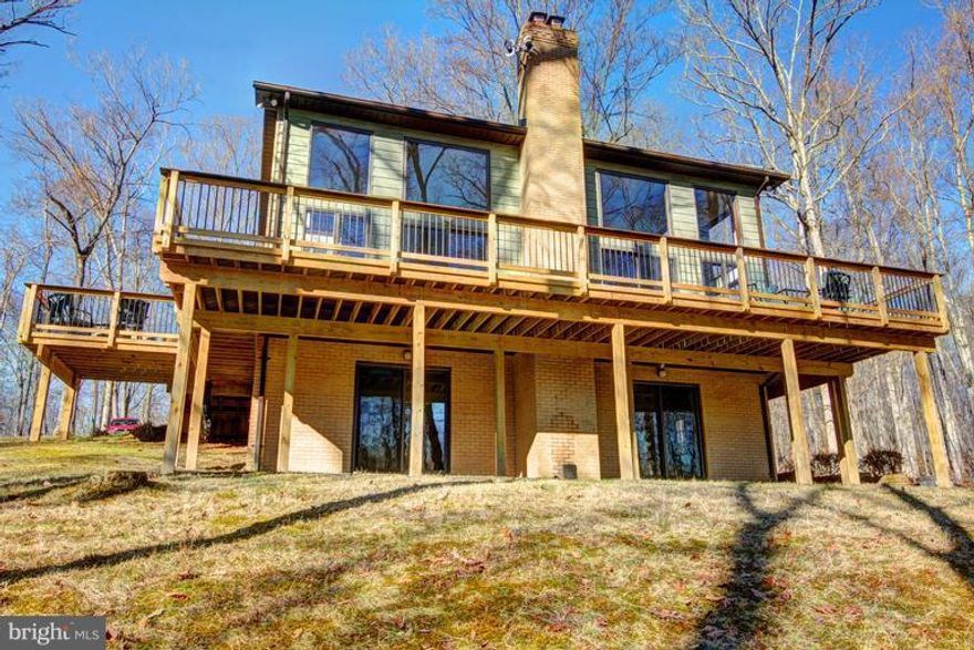 Great Location, private home on 14 acres, nestled on a wooded knoll overlooking creek with various wild-life. Main level master, light filled cathedral ceiling family room, hardwood floors, wrap around deck, walk out lower level. No HOA, Ashburn schools, and just minutes to Brambleton restaurants and movie theater. Easy access to Toll road, Dulles airport, and future metro station.