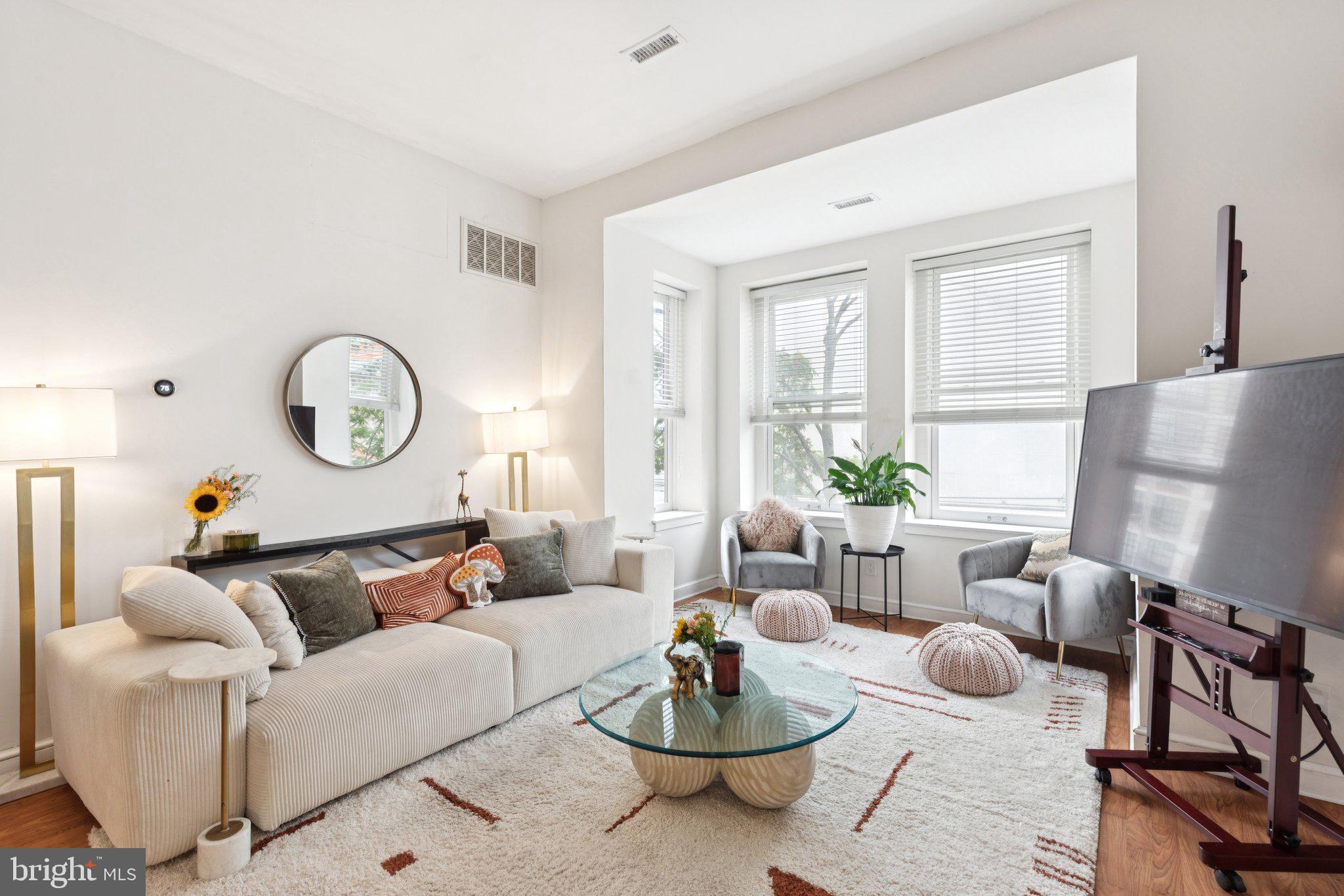 This sun-filled, 1-bedroom condo in a classic Fairmount brownstone combines historic charm, modern comfort—and the rare convenience of an assigned, secure PARKING space.
Located on the second floor, this beautifully maintained home features soaring ceilings and oversized corner windows that flood the space with natural light.
A welcoming entry foyer with a coat closet offers a flexible bonus area—perfect for a reading nook or compact home office. A passthrough to the kitchen enhances the open, connected feel of the layout.
The spacious living and dining area provides an elegant setting for both everyday living and entertaining, anchored by a charming bay window that adds character and additional seating. Just off the dining area, the galley-style kitchen features rich dark wood cabinetry, stainless steel appliances, and quartz countertops. A serving passthrough makes hosting effortless and keeps the kitchen connected to the main living space.
The bright and airy bedroom offers generous proportions, tall windows, and space to create a restful retreat. The full bathroom has been tastefully updated with timeless finishes, while an in-unit Samsung washer/dryer combo adds everyday convenience. Thoughtful nooks throughout the home provide options for a desk or work-from-home setup.
Additional highlights include access to a shared roof deck with sweeping neighborhood views, low condo fees, pet-friendly living, and common basement storage—plus your own designated parking space, a true luxury in the neighborhood.
Set in the historic Spring Garden section of the vibrant Art Museum area, this home is just steps from cultural landmarks, cozy cafés, and the lively dining scene along Fairmount Avenue.
A rare opportunity to own a piece of Philadelphia’s architectural history—without sacrificing the conveniences of modern living.