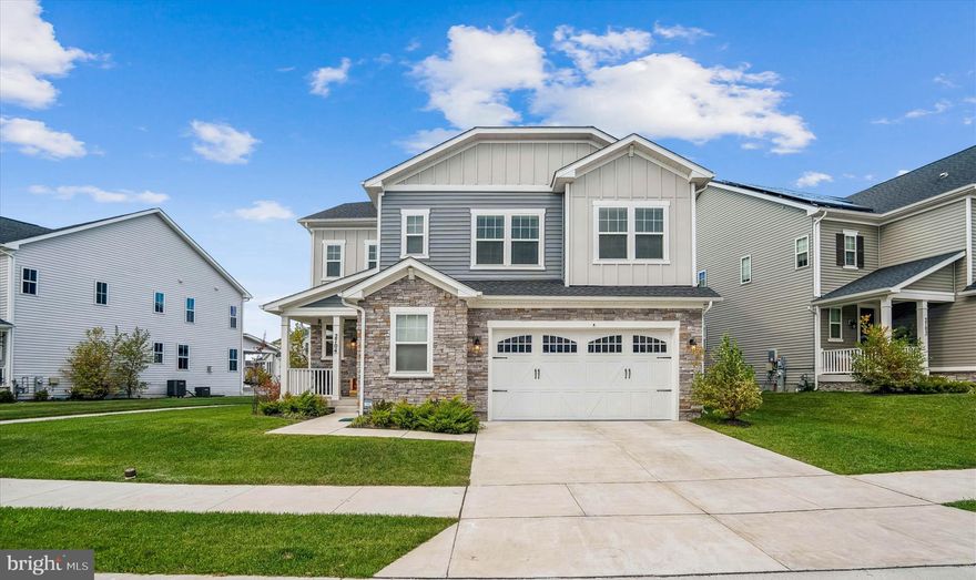 Rare opportunity in Two Rivers! Welcome to this beautifully upgraded 6-bedroom, 5 full bath Craftsman-style home located in the highly sought-after all-ages section of Two Rivers—offering exceptional space, flexibility, and modern design. Thoughtfully designed for today’s lifestyle, this home features a main-level guest suite with full bath, ideal for multigenerational living or extended stays. The open-concept main level is anchored by a designer kitchen showcasing GE Café appliances, an oversized quartz island, upgraded cabinetry, and stylish finishes—perfect for entertaining and everyday living. Upstairs, you’ll find four spacious bedrooms, including a luxurious primary suite with an impressive walk-in shower and spa-inspired bath. One secondary bedroom offers a private en-suite bath, while the upper-level loft/family room provides additional flexible living space. Convenient upper-level laundry adds to the home’s functionality. The finished lower level expands your options even further, featuring a large recreation room, media room, bedroom, and full bath—perfect for guests, entertaining, or a private retreat.  Enjoy outdoor living on the screened-in porch overlooking the paver patio and fully fenced backyard, ideal for relaxing or hosting gatherings. A unique bonus, the 2-car garage has a custom walk-in freezer, perfect for many needs. Located in the amenity-rich Two Rivers community, with a quick walk to pools, clubhouse, fitness center, trails, courts, and vibrant community events—all conveniently close to major commuter routes, shopping, and dining. Space, flexibility, and lifestyle—all in one exceptional home.