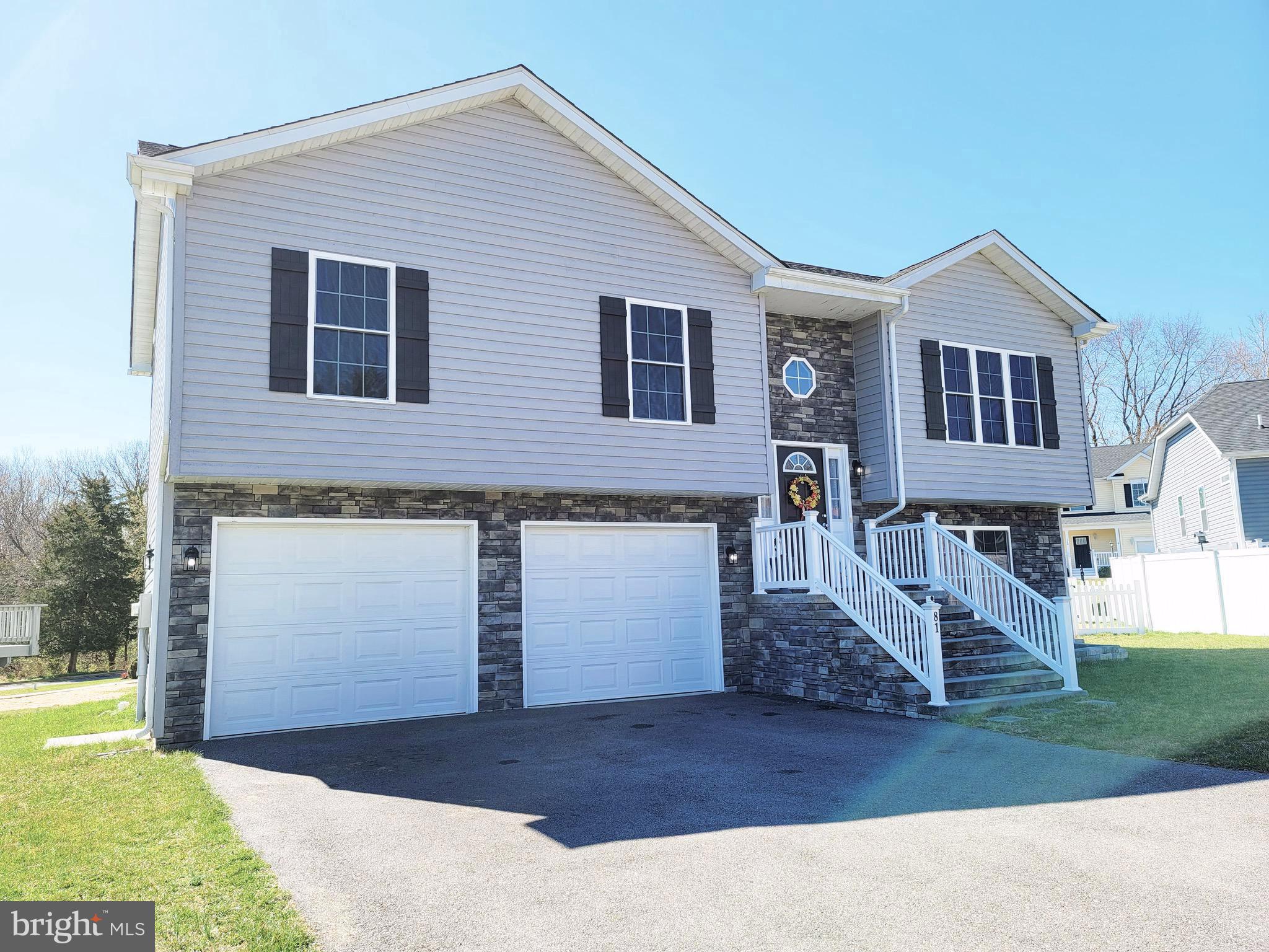 Beautiful Split Foyer home located in the Bolivar district of Harpers Ferry. This home offers an open floor plan on the main level and features a vaulted ceiling in the living/kitchen/dining area. The kitchen is equipped with stainless steel applicances, granite countertops with an island, and 42” inch cabinets. There are three bedrooms on the main level, including the master suite that has a large soaking tub/shower combination. The lower level has a fourth bedroom, a large recreation/second living room with lots of possibilities for use or entertaining, and a full bath with stacked washer/dryer. There is COREtec LVP flooring throughout the kitchen, living room, dining area, hallway, and entire lower level. The exterior of the home is beautifully finished with stone and gray siding. There is a deck on the back of the home with stairs leading to the backyard. There is an attached 2 car garage, with additional parking in the driveway. The location is amazing within, walking distance to downtown Harpers Ferry, and easy access to Northern Virginia, and Maryland.