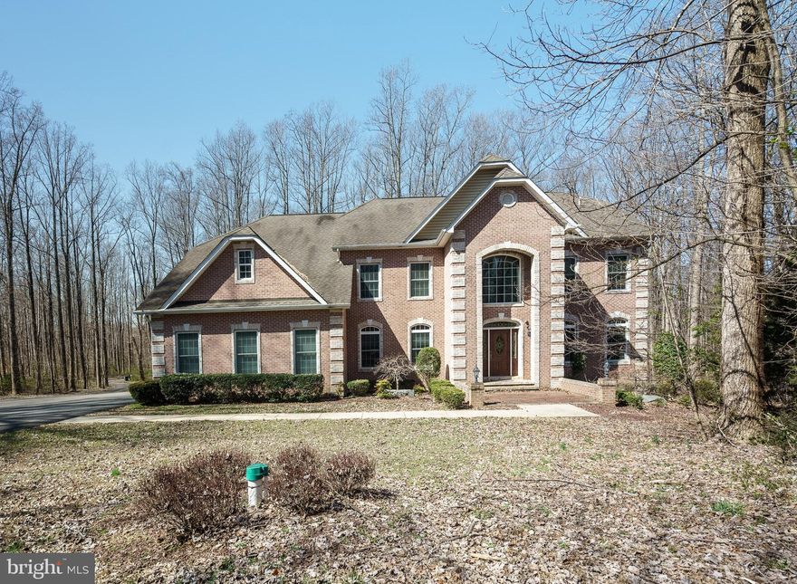 Magnificent home sitting on 5 acres of wooded land for sheer privacy.  The large master bedroom suite is located on its on floor with a cozy sunken room and gas fireplace to enjoy quiet time with a good book or a cup of coffee.  The huge private master bathroom has double sinks, a standalone shower and jacuzzi tub with a fireplace.  The remaining 3 large bedrooms share a full bathroom.  Huge kitchen with a gorgeous island that provides plenty of space for food prep and there is additional seating available.  Stainless steel appliances; Viking cooktop; convection oven and a pot filler faucet over the stove completes this kitchen along with a large kitchenette. There is also a gorgeous sunroom and small deck off of the kitchen. Spacious formal dining room; living room; great room; office; and half bath on the entry level. The basement is unfinished so that you can put your personal touch in a space that is great for entertaining. This home has amazing features such as two car garage and long drive for up to 6 vehicles; architectural roofing shingles that have a 50 year lifespan; backup power generator;  new water heater installed (2021); water softner, home warranty and no HOA.   In response to the Covid-19 pandemic seller requests a maximum of 3 people (including the agent) at a time when touring the property.