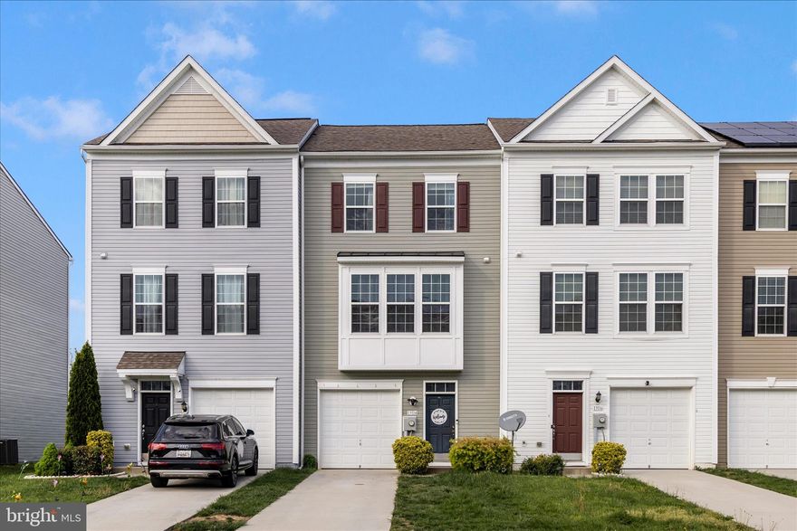 Upscale townhome for sale featuring bump-outs on all three levels and a one-car garage. Step into a spacious foyer with engineered hardwood flooring and a stunning staircase that sets the tone for the home. The bright living room is filled with natural light from an abundance of windows.

The kitchen is beautifully appointed with custom cabinetry with crown molding, two-tone granite countertops, and bar stool seating. Enjoy an eat-in kitchen area perfect for a breakfast table, along with a morning room bump-out that offers additional space for a large dining table or a second family room. Just off the kitchen, the deck is ideal for grilling while taking in scenic views of open farmland and silos.

A convenient half bathroom completes the main level. Upstairs, the oversized owner’s suite features a walk-in closet and a spacious en-suite bathroom with a soaking tub for two and a separate shower. Bedrooms two and three are generously sized and share a second full bathroom.

The finished lower level offers a large family room with walk-out access to the backyard and patio, along with a rough-in for a future third full bathroom. Additional highlights include a tankless water heater for endless hot water and a private, tree-lined backyard for added privacy.

Located in a desirable area close to shopping, restaurants, and major highways, this home combines comfort, style, and convenience.