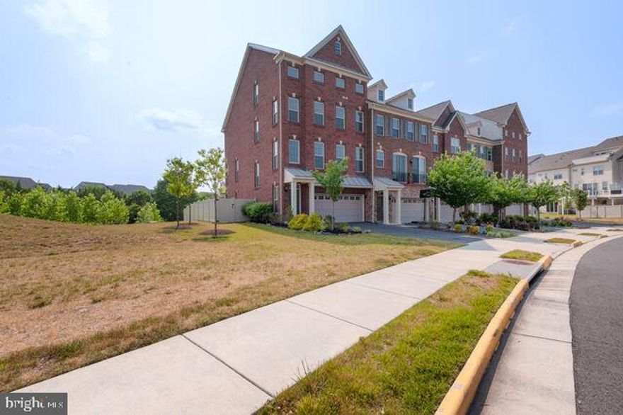 Beautiful Large 4 Story End-Unit Townhome in Amazing Resort Like Setting.  Black Hard Wood Floors, Granite Countertops, Island, Updated Bathrooms and Large Windows Throughout.  Incredible Top Floor with Separate Living and Roof Top Deck.  Rear Over Looks Natural Landscaping and Park Like Setting. Gym, Club House, Outdoor Pool and Tennis Right Across the Street. Trails, Playgrounds and Excellent Schools all Close By.  This Home Won't Last Long!!!!