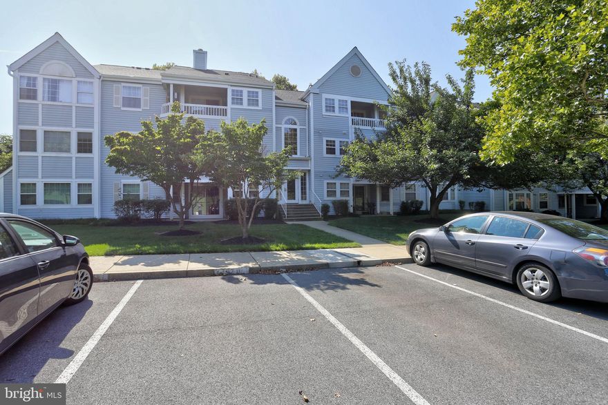 Welcome to this 2-Bedroom/2-Bathroom Condo in a secure building located in the quiet, amenity rich Village of Montgomery Run community of Ellicott City.   Step inside where an ample size hall closet and extra closet provides plenty of storage space. The galley style kitchen has plenty of cabinet space and includes all kitchen appliances as well as the stacked in-unit washer/dryer. The separate dining area features laminate hard flooring and offers space for entertaining. The wood-burning fireplace in the living room to makes your space cozy and perfect for relaxing.   Sliding doors open onto your balcony, perfect spot to get some time outside. The hallway leads to a sizeable second bedroom and a full bathroom. The primary suite offers a walk-in closet and private bathroom. The condo is waiting for your personal and finishing touches!  Great opportunity for an investor or new homeowner.  Convenient location near major highways and routes, Shipley Grant Shopping Center, minutes from parks, restaurants, and shopping.