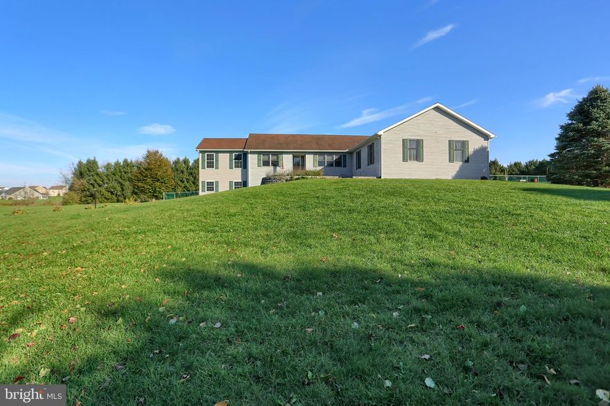 Wonderful Ranch home on 5+ prime acres with an open floor plan. The Great room features vaulted ceilings with skylights and french doors leading to the expansive composite deck. The beautifully updated kitchen features a large island, pot filler faucet, and also has a door leading to the deck. A spacious master bedroom and bath with a jetted tub are perfect for unwinding. Two additional bedrooms and a half bath round out the first floor. The Finished lower level features a family room with built-in cabinets, a wet bar, a cedar closet, and an office. The spacious In-law suite with kitchenette, living room, sunroom, and private entrance with its own parking space provides lots of opportunities. Massive metal building with lots of natural light provides endless possibilities. Detached two-car garage with ample parking for anything from an RV to multiple cars or trailers. Call Today to schedule your private showing!