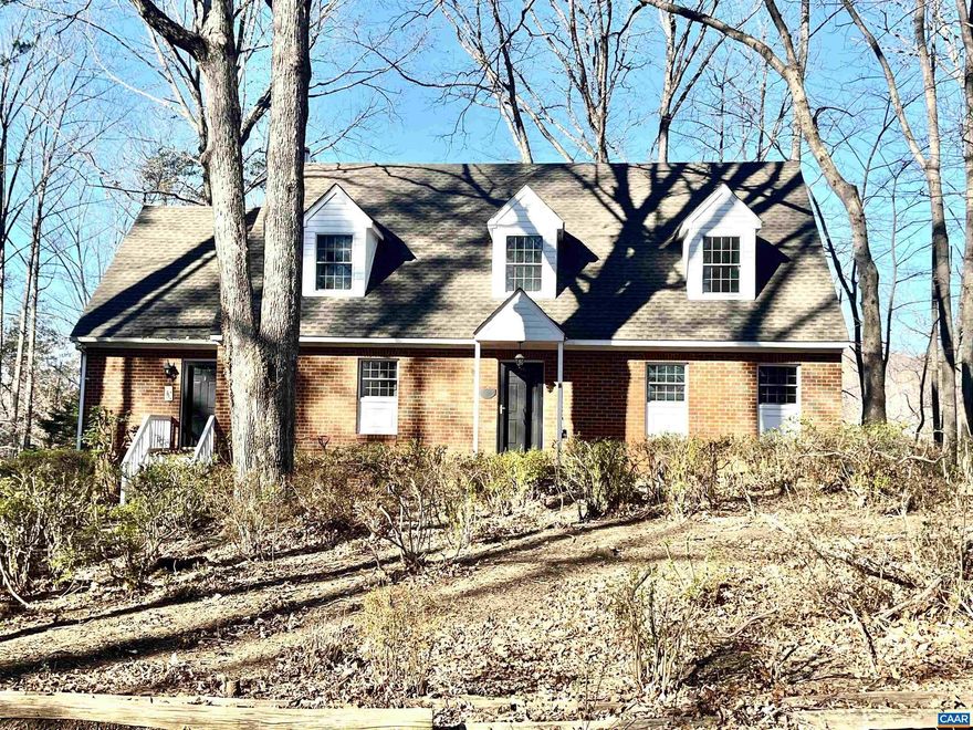 A classic Colonial Cape Cod perched on a knoll overlooking an expansive field with long frontage on Stockton Creek in Western Albemarle. This fine county property offers complete privacy with Blue Ridge mountain views and wonderful convenience to western Albemarle schools and Crozet. A custom brick home offers an open floor plan with many traditional features; such as heart pine flooring & wood-burning fireplace & wood stove. The rear elevation has a screened porch that is flanked by decking on both sides. Full walk-out basement with home office and two-car garage. Central vacuum, home generator and second floor storage room. Land is suitable for horses, other livestock or crops with a small two-bay barn. Great garden space. 2,265 feet of frontage on the Stockton Creek makes this a great recreational property that attracts all types of wildlife. Development rights.,Painted Cabinets,Fireplace in Kitchen,Fireplace in Living Room
