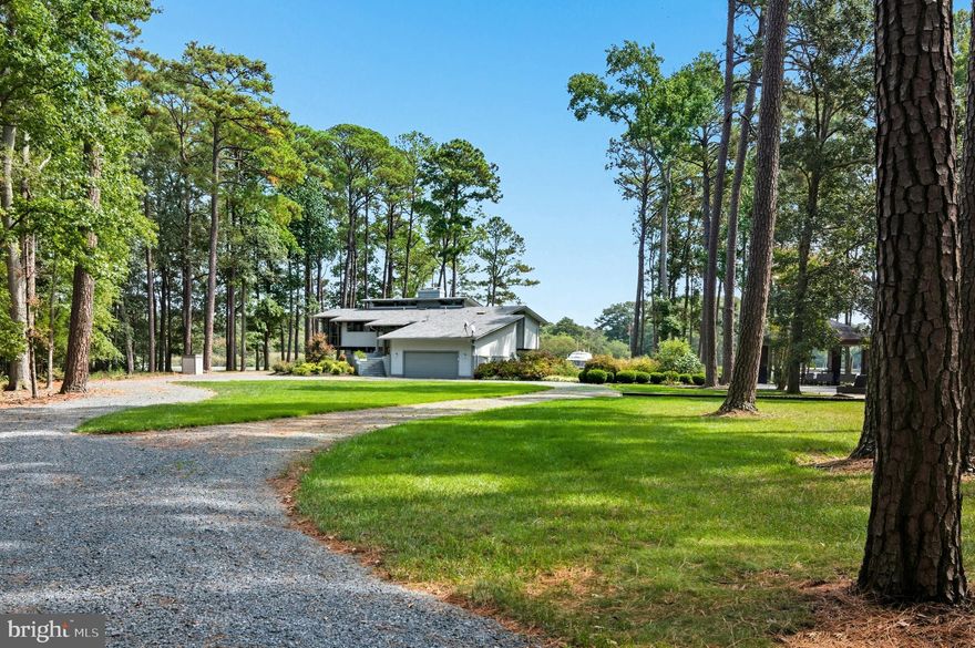 Absolutely stunning mid-century contemporary estate offering a private , park-like setting, with heated swimming pool, pavilion, luxurious fully equipped outdoor- kitchen, outdoor shower, in -ground hot tub ,tennis court, and maintenance -free Azek pier with new 30K lb. boat lift.  Meticulously  maintained  inside and out!  Professionally landscaped with WiFi controlled front/rear irrigation system.The superbly designed and crafted home offers an open floor-plan with 4 bedrooms and an office, 3.5 designer baths with heated floors,, a magnificent  gourmet kitchen, upper and lower level living areas  providing outstanding functionality.  Breathtaking water- views and protected shoreline!  This is an outstanding turn-key property that comes beautifully furnished !