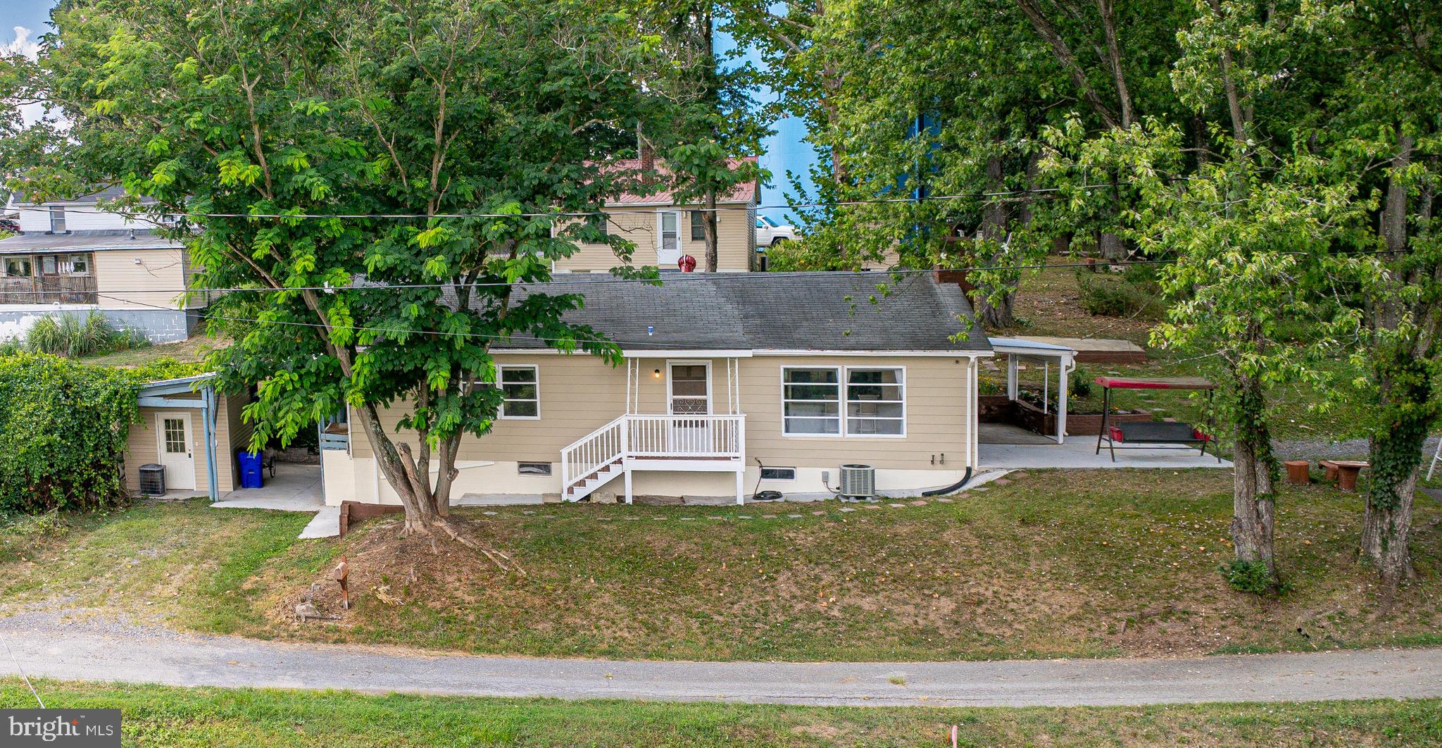 Fully Remodeled Ranch-Style Home with Stunning Mountain Views – 29 Parrell St, Hancock, MD
Welcome to this beautifully remodeled 3-bedroom, 2-bath ranch home of stylish living space in the heart of Hancock. Tucked away at the end of a quiet dead-end street, this charming property combines modern updates, peaceful surroundings, and incredible mountain views — all in a convenient in-town location.
Inside, you’ll find a freshly painted interior and a spacious layout, including a bright living room and bedrooms that all enjoy serene mountain vistas. Wake up each morning to breathtaking views from your bedroom window, relax in the living room as sunlight pours in, or sip coffee on the front porch while taking in the natural beauty — and on clear nights, enjoy a sky full of stars.
The home features:
3 comfortable bedrooms and 2 full baths
Fully remodeled interior with fresh paint throughout
Ranch-style layout with main-level, wheelchair-accessible entry
Unfinished basement with laundry area and great for storage or a work shop.
Long private driveway with carport for covered parking
Lovely covered side porch — perfect for relaxing or entertaining
Finished attic extra storage area
Bonus shed/office space for storage, hobbies, or a home workspace
Located just minutes from local shops, restaurants, parks, and the C&O Canal, this home offers both tranquility and accessibility. With its scenic setting, thoughtful updates, and versatile spaces, 29 Parrell St is move-in ready and waiting for you to make it your own.
Schedule your private showing today and see everything this gem has to offer!
(Some photos are virtually staged to give you a better vision)