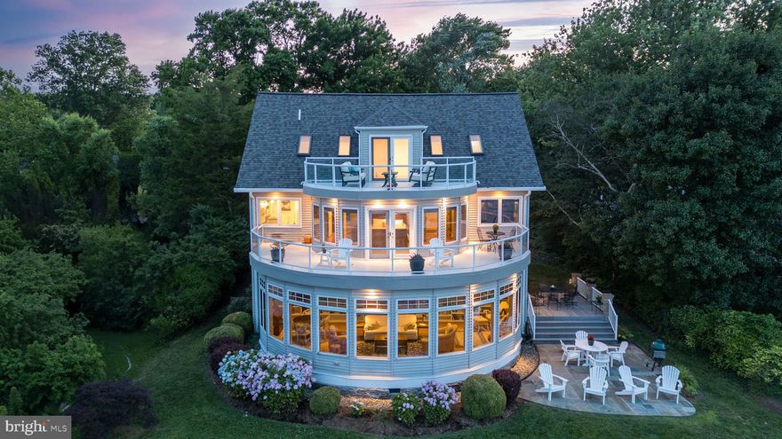 INCREDIBLE VALUE!!Exceptional waterfront cinematic views of the Chesapeake Bay with a 100+ foot pier complete with electricity, fresh water, and a 12,000 pound boat lift awaits from this 5 BR, 3 FB custom-built residence  combining both contemporary and traditional architecture! Look no further if you desire: unobstructed views of sunrises, sunsets, and firework displays; crabbing, fishing, bird watching and boating from your private exclusive pier or boat or sail over to the nearby Fair Haven beach with neighbors and friends! Bay views surround you from the living and dining rooms, kitchen, master bedroom and from the curved wraparound deck on each of the 3 levels of this resplendent home!  OPEN HOUSE SUNDAY, AUGUST 11TH 1:00-4:00PM. Extraordinary features include a new 50-yr roof,; electric car charger in garage; 3-story entry foyer with direct view of the bay once you open the double-entry glass doors;  master bedroom boasts a separate Jacuzzi tub and steam shower with dual massage heads plus its own office or sitting room; gourmet kitchen with black granite counters, pot boiler and pasta arm; 42" cherry cabinetry and Wolf stainless stove & exhaust fan;  separate main level bar; newly finished top level plumbed for full bath &/or bar; each floor has its own ac & heating system; in-ground sprinkler system; Ring security system, 30' 2006 Grady-White Marlin Boat with only 357 hours of use for add'l sale of $115,000, amongst many other amenities.  Just 30 miles from DC and 20 miles from Annapolis; North Beach and Chesapeake Beach are within a 13-minute drive. Deale is 3 minutes away..  Tracys Landing offers a tranquil spot to enjoy everything that nature has to offer yet provides many charming bayside and beachside restaurants, shops & entertainment within a short drive. Paradise has arrived!