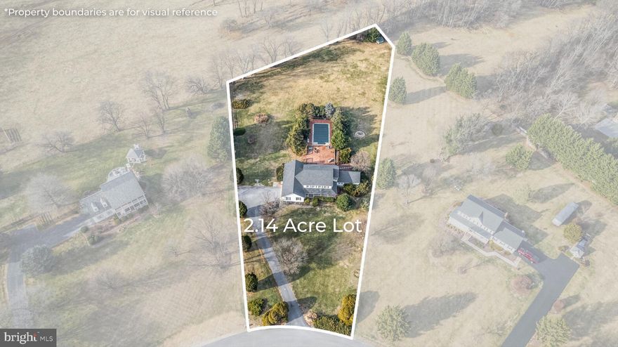 Offered for the first time since its construction in 1993, this exceptional home presents a rare opportunity to own a timeless property in the heart of the sought-after Arden area. Situated on just over two pristine acres, the setting offers privacy, backs to farmland, and mountain views that create a truly special backdrop. From the wraparound porch and side-loading garage to the newer roof, screened-in porch, in-ground pool, and main-level primary bedroom, this home checks every box while maintaining warmth and character throughout. Step inside to hardwood floors, shiplap detailing, and a thoughtfully designed layout offering remarkable flexibility. The welcoming entry space can easily function as a formal dining room, sitting area, home office, or creative flex space. The light-filled kitchen features newer appliances, an eat-in area, and seamless flow to the outdoor living spaces, making it ideal for everyday living and entertaining. The main-level primary suite offers an en-suite bath and two closets, while the expansive informal living room showcases picturesque views through a large window. A convenient half bath, laundry room, and direct garage access complete the main level. Upstairs, you’ll find three additional bedrooms and two full bathrooms, including a second-level primary suite with an en-suite bath featuring dual vanities, a soaking tub, separate shower, and ample storage. The unfinished basement provides endless potential for future expansion, additional living space, or generous storage. The backyard is truly the showstopper. Step from the kitchen onto a covered deck leading to a screened-in porch, then out to a newer hot tub, expansive deck, and large in-ground pool, all set against peaceful farmland views that offer both beauty and privacy. This is a rare first-time offering of a home that has been lovingly maintained and thoughtfully designed. Schedule your private showing and experience this extraordinary property for yourself.