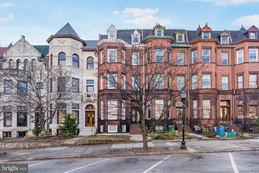 Welcome home to this magnificent and fully renovated townhome in the revered Historic Reservoir Hill featuring over 5700 square feet of finished living space.  Gleaming hardwood floors, high ceilings, modern amenities and exceptional classic design from the chair railings, geometric tray ceilings, spacious living and dining rooms to the modern eat-in gourmet kitchen with breakfast island, gleaming countertops and backsplash, gas stove with downdraft, stainless steel refrigerator, and large brand new windows allowing sunlight to stream in throughout the day. The grand staircase leads to the second floor with 3 carpeted bedrooms, and 2 full bathrooms each with unique tile design, and washer and dryer hook-ups in the hallway. On the third level is the spacious Owner’s Suite with tray ceiling, recessed lighting and ensuite spa bathroom retreat with dual vanity, jetted soaking tub and shower, and down the hall is a second large bedroom with ensuite bathroom.  On the fourth level is a loft, and it is a great space for an office, a peleton/yoga/exercise area, or hobby space.  On the lower level is a spacious family room with a stately wet bar with granite countertop, 2 bedrooms, a full bathroom and additional laundry hook-ups. Everything in this grand home is brand new including the Roof, Dual Zoned HVACs, 2 Hot Water Heaters and All the Windows! The spacious backyard is the final touch to making this wonderful home the perfect place to entertain your family and friends. Close to parks, restaurants, shopping, and expressways. Rarely available opportunity to own a 'Brownstone' on one of Baltimore's most desired and architectural appealing streets!