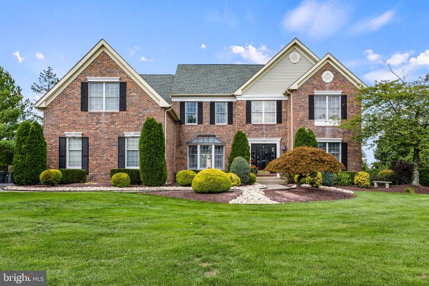 Picture perfect curb appeal welcomes you to this stylish Northampton Chase brick front, 4 bed, 2.2 bath Colonial offering amazing character and is move-in ready! Beautifully maintained both inside and out and ideally positioned on over a half-acre premium lot backing to farmland, this grand home features many welcoming comforts such as high ceilings, oversized main floor study and laundry room, open concept living and versatile space throughout.  Striking accents, to highlight a few, include an ornate wrought iron turned staircase, handcrafted millwork and decorative moldings, architectural elements, French doors, built-ins and striking hardwood floors. The ease of entertainment flow can be found along with style and functionality with the gourmet kitchen, airy dining room, bright family and living room areas creating ample open space and a centerpiece ideal for gatherings. The kitchen features an amazing center island decorated with ornate wood detail surrounded by an abundance of rich maple cabinets, adorned with granite counter tops, coordinating tile backsplash and high-end stainless appliances plus an oversized Sub-Zero refrigerator. Vaulted ceilings with streams of natural light through skylights add vastness to the family room adorn with sunburst windows and craftsman custom built ins edging the gas fireplace. The series of columns separating the living room and family room add an exceptional dimension to the main floor. A favorite room will be the octagon, greenhouse shaped sunroom fully surrounded by windows allowing for picturesque views of the impressive backyard oasis and pool area which is accessible through multiple areas that open to it. The backyard sanctuary affords unobstructed sunset views over open fields from the step-down sunroom, flagstone patio or pool with waterfall feature. Completing the first floor is the laundry/mudroom with a half bath for the comfort of your pool guests. The upper level, which can be accessed from the front or rear staircase, is equally impressive, beginning with an open landing showcasing an overhang with views of the family room below.  The expanded Primary Suite exudes a serene atmosphere and is anchored by both a sitting room adorn with gas fireplace and a bonus room currently used as a nursey. His and her walk-in closets are featured near its entrance along with a roomy full bath ornamented with an oversized jetted tub centered between two separate vanities in addition to a corner shower stall. The 3 other bedrooms on this level sharing a double sink vanity hall bath are also accessorized with hard wood floors, one is plumbed for a bathroom, becoming its own princess suite. Downstairs, the spacious basement offers additional living space and is awaiting your design. Additional amenities include fenced-in backyard, storage shed, 3-car garage, paver sidewalk, composite low maintenance deck,  HVAC system, and children’s outdoor 2-story playset. The current owners have lovingly maintained and impeccably improved this home over their ownership  making it one of the best in this highly sought after community within the award-winning Council Rock School District. Come make it yours today….it won’t last long!