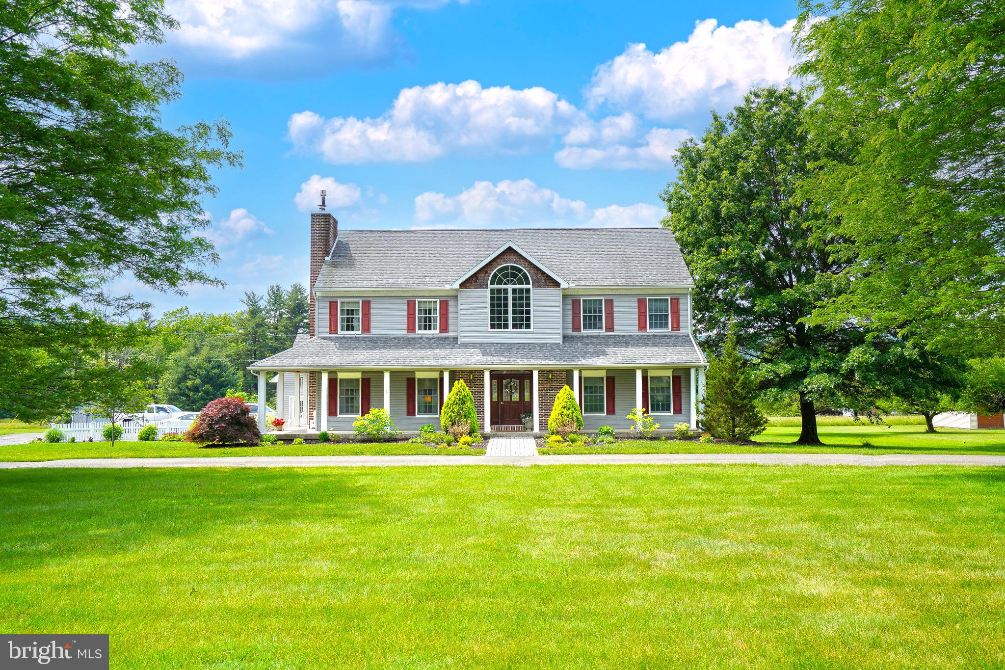 Hometown manse on two acres offers the best in location, space, and living! A covered porch spans the front and side of the home and welcomes you into a soaring two-story foyer. Main level: two front reception rooms, ideal formal and family living rooms, formal dining room and stunning eat-in kitchen with every detail in both style and substance met! Laundry room and half bath complete this level. Climbing the grand stair, a window seat beneath a soaring front window overlooks the light flooded upper hall. Four beds are crowned by a master suite featuring walk-in closet and ensuite with jetted tub, stunning shower and dual vanities. Hall bath also offers tile surround and double vanity. The basement is finished, offering a second full kitchen, full bath, utility room, and ample multipurpose space! The attached three-car garage offers a second level of storage and creates a private corner which holds the yard’s fenced portion and the home’s stunning concreate patio and inground pool!