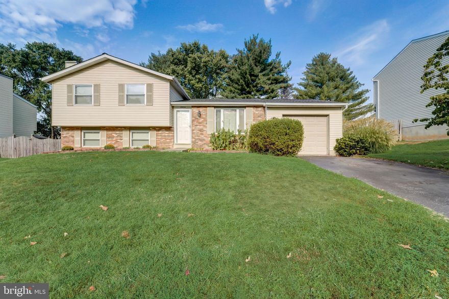 *OFFER DEADLINE: MONDAY, 09/18 @ 12 NOON - PLEASE SUBMIT ALL OFFERS BY DEADLINE*
Welcome to this charming 3 bedroom, split level home with 2.5 baths, and a one car attached garage, offers a range of delightful features. Step inside to find freshly painted rooms that exude a clean and inviting ambiance. The fully equipped kitchen boasts a new stainless steel fridge, ensuring your culinary adventures are a breeze. The adjacent dining room flows into the living room and both are adorned with updated wood-look laminate flooring, along with easy access to the garage and a slider that opens up to a spacious deck overlooking the fully fenced and gated yard and shed. Venturing upstairs, you'll discover new wall-to-wall carpeting throughout. The primary bedroom includes an ensuite primary bath. featuring a shower, with updated toilet and vanity for your comfort, as well as in two additional bedrooms and a full hall bath, with tub-shower, also with updated vanity and toilet. The walk-up lower level is perfect for relaxation, featuring a family room with updated wood-look laminate flooring and a brick wood-burning fireplace with a wood mantle and glass doors. Additionally, there's a half bath with an updated pedestal sink and toilet for your guests' convenience. The utility/storage room is a handy space, complete with a washer and dryer, a second refrigerator, and shelving that conveys with the property. It also provides access to the back yard. Lastly, this home boasts a BRAND NEW washer and dryer - as well as a BRAND NEW roof, ensuring your investment is well-protected. Don't miss the opportunity to make this lovely property your new home sweet home.