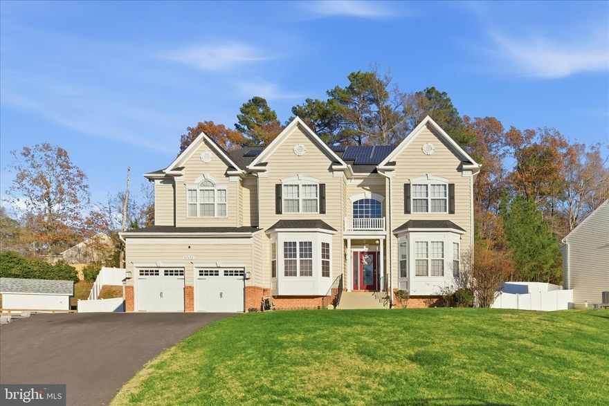 Welcome to 45656 Edge Mill Ct, a stately 5‑bedroom, 3.5‑bath Colonial tucked on a quiet cul‑de‑sac in Great Mills’ desirable Woodland Park. With over 5,600 square feet of premium living space, this home is ideal for entertaining, everyday comfort, and multi‑generational living.

Step inside the grand 2‑story foyer, where gleaming hardwood floors, crown molding, and wainscoting set a refined tone. The sun‑filled main level offers a formal dining room with tray ceilings, an inviting living room, and a spacious family room anchored by a gas fireplace, perfect for welcoming friends and family.

The gourmet kitchen boasts extended cabinetry, stainless‑steel appliances, and a generous breakfast bar large enough to seat 6–8 comfortably — a natural hub for casual meals or linger‑longer conversations. Adjacent is a bright sun‑drenched eat‑in area framed by arched windows and skylights, creating an airy and welcoming vibe from morning coffee to evening dinners.

Upstairs, the luxurious primary suite offers a private sitting area, dual walk‑in closets, and a spa‑inspired en suite featuring a soaking tub, double shower, and dual vanities. Three additional roomy bedrooms complete the upper level.

Downstairs, the fully finished basement delivers a 5th bedroom, full bath, a home‑theatre/entertainment room, and a wet bar perfect as a guest retreat, teen‑suite, or private work‑from‑home zone.  Outside, enjoy the paver patio and built‑in firepit ideal for crisp fall evenings or summer BBQ nights. A 3‑car garage plus an additional storage shed ensure there’s room for vehicles, gear, and more.

Just minutes away is Naval Air Station Patuxent River (NAS Pax River), a major regional employer and hub of naval aviation and defense operations. The home’s ease of commute makes it a strong fit for active‑duty personnel, DoD contractors, or anyone seeking convenient access to base while enjoying a peaceful suburban lifestyle.  Convenient to shopping, dining, schools, and recreation