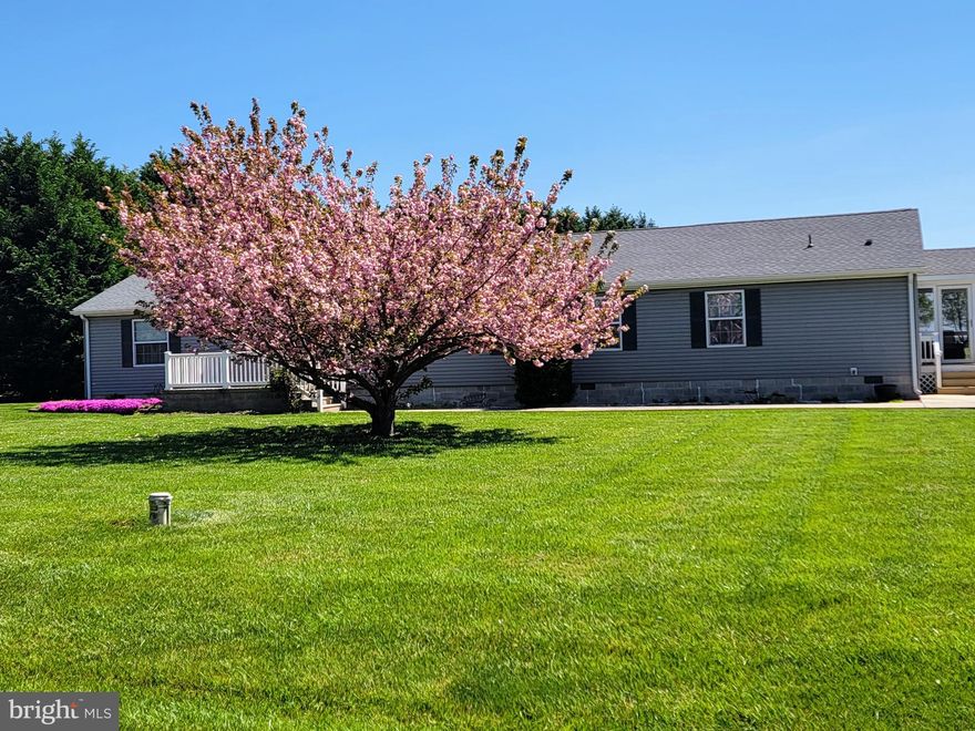 Welcome to this immaculately maintained, spacious 1980 square foot home. As you step inside, you'll be greeted by a large family room that seamlessly flows into the dining room, where sliding doors lead out to a 16 X 16 deck - perfect for hosting family barbecues. The country kitchen is equipped with everything you need, including a double bowl sink, dishwasher, oven/range,  refrigerator, and a large pantry.
This charming home features 3 bedrooms, each with ample closet space, 2 full bathrooms, and a powder room. At the far end of the home, you'll find a cozy den, an office area, a laundry room, and a screened-in porch - ideal for relaxing in the fresh air.
The property boasts two large outbuildings - a 32 X 14 shed and a 24 X 11 outbuilding, both of which are large enough to park a car and provide ample space for storing your yard tools, toys, and riding mower. The 1.24-acre lot is beautifully landscaped, with mature trees that provide added privacy and lush green grass that's perfect for outdoor activities. In the spring, the mature cherry tree in the front yard blooms with magnificent pink double blossoms.
Just a short walk away from the property, you'll find a small pond that's a perfect spot for teaching children how to catch fish. And with Suicide Bridge Restaurant, East New Market, and the town of Hurlock just minutes away, you'll have easy access to all the amenities you need.
Don't miss out on the opportunity to make this meticulously maintained property your forever home.