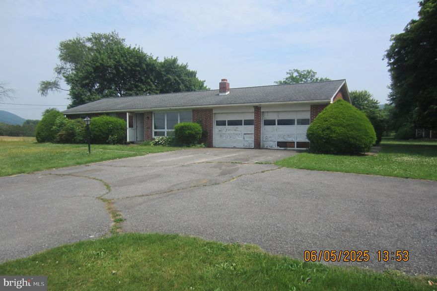 ***CALLING ALL INVESTORS AND DIY BUYERS*** This ALL BRICK 3 bedroom 1 full bath RANCH HOME with an oversized 2 car garage (27'X22'), hardwood floors, GOURGOUS 1.2 ACRE LOT FEATURING MOUNTAIN VIEWS, and lovely covered back patio will likely draw a lot of attention.  Partially finished basement with floor to ceiling stone fireplace. The roof has architectural shingles.  Driveway with additional pull aside parking for 2  cars. Great location near all amenities. This property appears to have great bones and has a very solid ALL BRICK EXTERIOR.*** SOLD AS IS. HOUSE SOLD ON BEHALF OF SELLER BY PA STATE COURT APPOINTED GUARDIAN. FINAL SALE CONTINGENT ON COURT APPROVAL. COURT APPROVAL WILL DELAY SETTLEMENT BY SEVERAL WEEKS***ALL CONTENTS REMAINING AT PROPERTY ON DAY OF WALK THROUGH CONVEY TO BUYER***