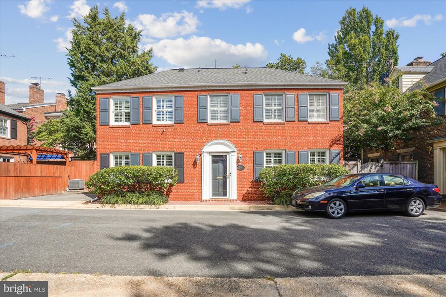OPEN HOUSE CANCELLED - UNDER CONTRACT. Experience the best of Old Town living in this rare all-brick, free-standing detached home tucked away on a quiet cul-de-sac in the sought-after SE Quadrant. Featuring 3 bedrooms and 2.5 baths, this residence blends timeless character with thoughtful updates. The inviting living room with a cozy gas fireplace opens to a private patio with a retractable awning—perfect for indoor-outdoor entertaining. A separate dining room with built-in cabinetry adds both elegance and functionality, while the kitchen offers stainless steel appliances, abundant cabinetry, and a brand-new washer and dryer.
Upstairs, you’ll find three bedrooms: a spacious primary suite with an updated ensuite bath and customized closet, a second bedroom with generous space, and a third bedroom with built-ins—ideal as an office or guest room. An updated hall bath with walk-in shower completes the upper level.
Additional highlights include gleaming hardwood floors on both levels, parking for two cars (one off-street plus an additional space directly in front of the home), plantation shutters, attic with pull-down stairs and partially floored for storage, and no HOA! Perfectly situated within walking distance to the Potomac River, bike paths, waterfront parks, and Old Town’s vibrant shops and award-winning restaurants, this home offers the best in comfort, convenience, and lifestyle.
