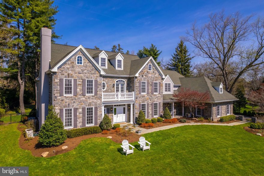 Welcome to an exceptional Main Line property situated on nearly one professionally landscaped acre. This stone and HardiePlank home exemplifies luxury living and offers an open floor plan with extensive amenities including beautiful millwork, site finished hardwood flooring, beautiful finishes, 9’+ ceiling heights and a generator.  A slate walkway leads to the dramatic entry foyer with an impressive staircase. To the left is the formal living room with fireplace, powder room and large office with wall of custom built-ins and French doors to one of the rear terraces. To the right is the formal dining room with butlers pantry that includes a beverage fridge, sink and large walk-in pantry. A spacious, open family room with gas fireplace with built-ins has French doors to the rear terrace. The gourmet kitchen features granite countertops, stainless steel appliances, and large center island with seating that overlooks the sunlit breakfast area. Adjoining the kitchen is a sunny mudroom which leads to the yard and garden. A second mudroom with storage cubbies and a double coat closet offers access to the oversized 3-car garage. The second floor primary retreat occupies its own private wing with dual walk-in closets and fabulous bathroom with dual vanities, large whirlpool tub, separate walk-in shower and WC. There are two additional large ensuite bedrooms, each with walk-in closets, as well as two bedrooms with a jack and jill bath. The laundry room, home gym and homework area complete the second floor. The walk up third floor offers 1199 sq ft of exceptional unfinished space that would make the perfect media room, game room or au pair suite. The finished lower level offers an additional 2000 sq ft of living and relaxation space, including a full bath and additional storage room. The rear yard is a true private oasis with a stunning in-ground pool with a waterfall, multiple sitting areas, fire pit, and a custom-designed, enclosed organic garden with raised beds. In a fantastic location with award-winning Radnor schools, 410 Barclay Road is an exceptional property convenient to Center City, the train station, shopping, restaurants and major roads, as well as all the wonderful amenities Bryn Mawr has to offer.