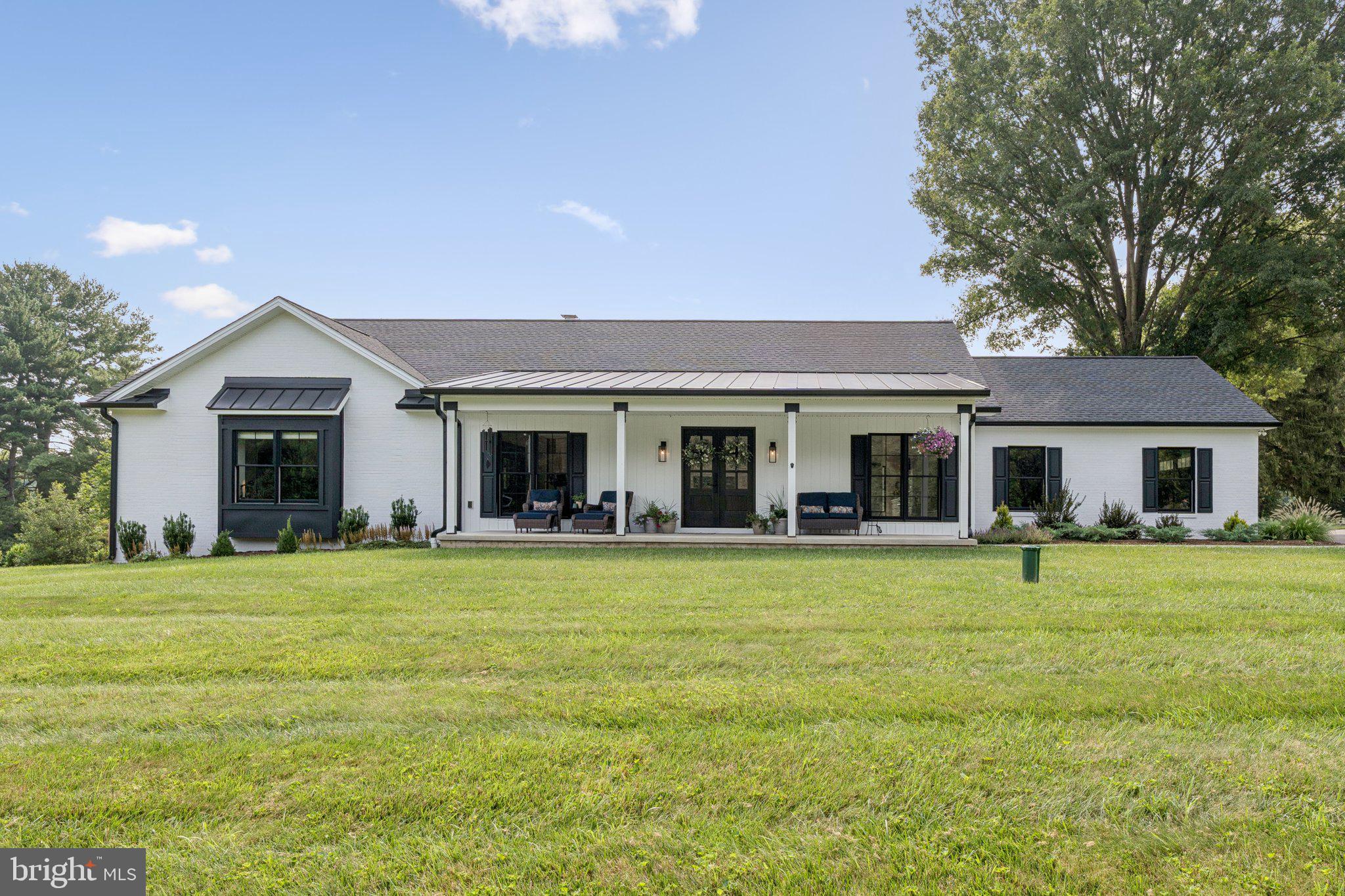 Welcome to this gorgeous, completely renovated one-level home with a finished walkout basement, perfectly situated in the desirable Woodmark community. Thoughtfully redesigned with high-end finishes and custom craftsmanship throughout, this home offers modern luxury, functionality, and serene living on two beautifully landscaped, rolling acres. Step inside to a light-filled great room featuring soaring vaulted ceilings, a cozy fireplace, and an open-concept layout ideal for everyday living and entertaining. The heart of the home is the show-stopping kitchen, boasting custom-built cabinetry, premium appliances, a spacious island, and a walk-in pantry that checks every box for the home chef. Adjacent, the custom laundry/mudroom is both stylish and practical, designed with custom cabinets for added storage and organization.
The main level includes a luxurious primary suite complete with a spa-inspired bath featuring a floating tub, walk-in shower, and generous walk-in closets. An additional bedroom, a versatile office or third bedroom, and a beautifully appointed hall bath and powder room complete the main floor.
The finished lower level offers incredible bonus space with a massive recreation room, a walk-out to the backyard, an additional bedroom and full bath—perfect for guests or multi-generational living—along with a utility room and ample storage. Outside, enjoy peaceful views and refined outdoor living. The backyard includes a stunning deck, an elegant seating area with firepit, garden space, and plenty of room to roam. The oversized 2-car garage and expansive driveway provide abundant parking.
Every detail has been meticulously curated in this one-of-a-kind, custom-designed home. Don’t miss this rare opportunity to own a truly exceptional property in a private, picturesque setting.
