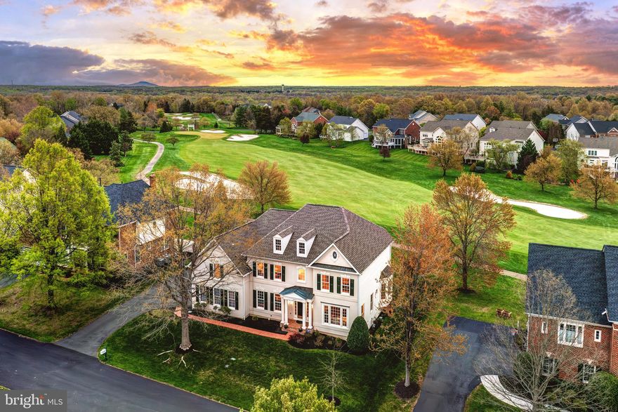 Open house canceled - we are under contract

Experience exceptional living in River Creek, a sought-after gated golf community offering a pristine lifestyle along the scenic Potomac River. This meticulously maintained property, offered for the first time by the original owners, sits on over a quarter-acre lot backing directly to the 13th hole and picturesque golf-course views. Extensively updated inside and out, the home boasts impressive indoor and outdoor living areas, including a thoughtfully designed entertainer’s walk-up lower level. Upon entry, solid 3/4” walnut floors welcome you to a spacious foyer, sweeping staircase, and formal entertaining rooms adorned with elegant traditional moldings. The expansive family room achieves grand proportions, featuring soaring two-story ceilings, enormous windows filling the space with natural light and golf-course views, and a centerpiece fireplace. Transition seamlessly to the custom remodeled kitchen, fully reimagined with commercial-grade appliances, quartz countertops, extensive floor-to-ceiling cabinetry, coffered ceiling with recessed lighting, and a generous granite island with prep sink and eat-in dining options. The adjacent sunroom and multiple exterior doors offer effortless access to outdoor living spaces, including a deck and flagstone patio with a built-in seating wall, perfect for relaxing against the backdrop of sprawling greens and fairways. The main level also includes a private executive office, updated powder bath, and mudroom with access to the garage. Upstairs, retreat to the palatial primary suite, featuring an airy tray ceiling, sitting area, double vanity bath, soaking tub, separate shower, and a generously sized walk-in closet. This level also offers an additional large bedroom suite with private bath, and two bedrooms joined by an updated jack-and-jill bathroom. The fully finished lower level is designed for entertainment and leisure. It features a spacious recreation room with engineered Brazilian-cherry floors, lounge areas with fresh carpet in 2024, and a deluxe built-in wet bar with custom bullnose oak and granite countertops, built-in refrigerator, wine cooler, and custom Merillat cabinetry. A fully-equipped custom theater room with projection screen and surround sound, a dedicated gym room, laundry room with upgraded front-loaders, finished storage room, and a full bath complete the lower level. Owner improvements are numerous and thoughtful, including a new roof and gutters (2020), walnut floors on the main level (2021), all new carpeting (2024), upgraded Carrier HVAC systems, water heater with thermal expansion tank, and a six-zone automatic irrigation system. River Creek residents enjoy premium amenities, highlighted by an 18-hole championship golf course designed by Ault-Clark, tennis courts, swimming pools, playgrounds, basketball and volleyball courts, kayak dock, scenic pocket parks, and extensive hiker/biker trails. The clubhouse, perched above the Potomac River bluffs, offers exceptional dining under an executive chef previously serving The White House, along with spaces to socialize and take in the breathtaking river views. This location provides easy access to the Potomac River and nearby Red Rock Wilderness Overlook Regional Park, as well as Route 7, historic Leesburg, and all the best of northern VA. River Creek’s HOA maintains beautifully landscaped common areas, waterfalls, pond fountains, snow removal, gated access control, and more. Enjoy a rare balance of sophisticated living, community charm, and the natural beauty of golf course and river vistas at this thoughtfully upgraded River Creek home.